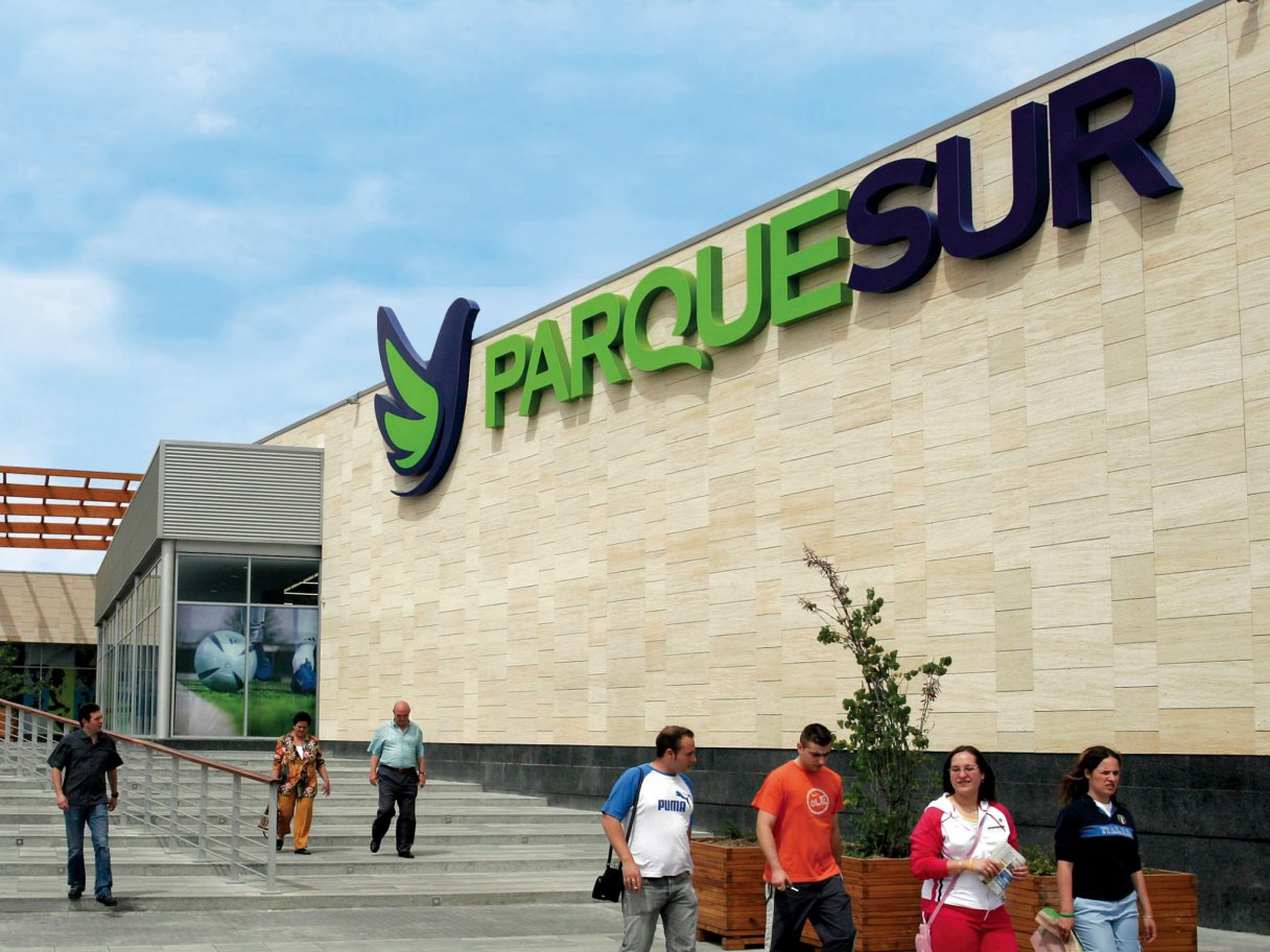 Rooftops of a coastal town with the sea in background