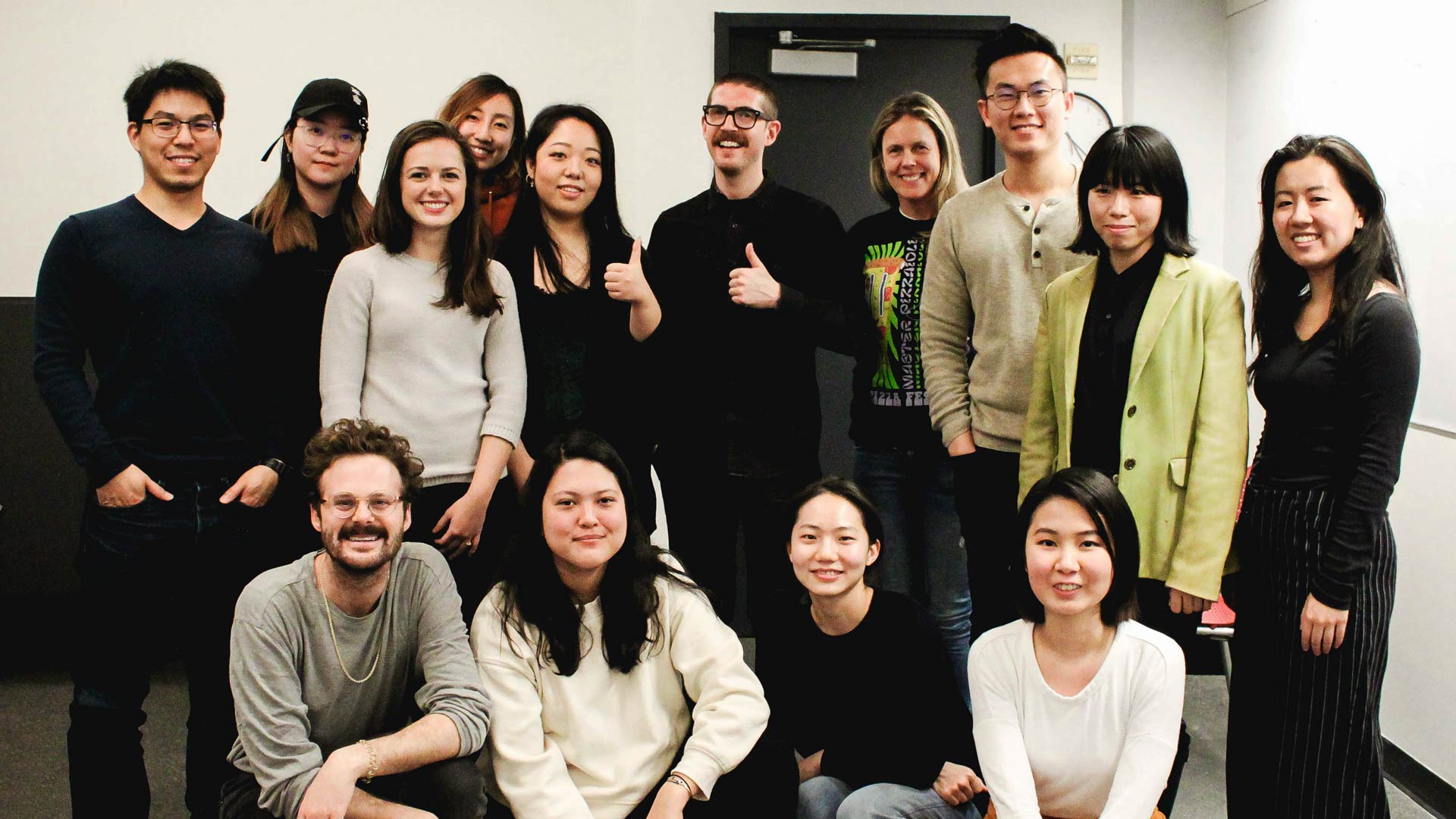 SVA MFA Design students posing for a photo with Jesse Reed in the classroom