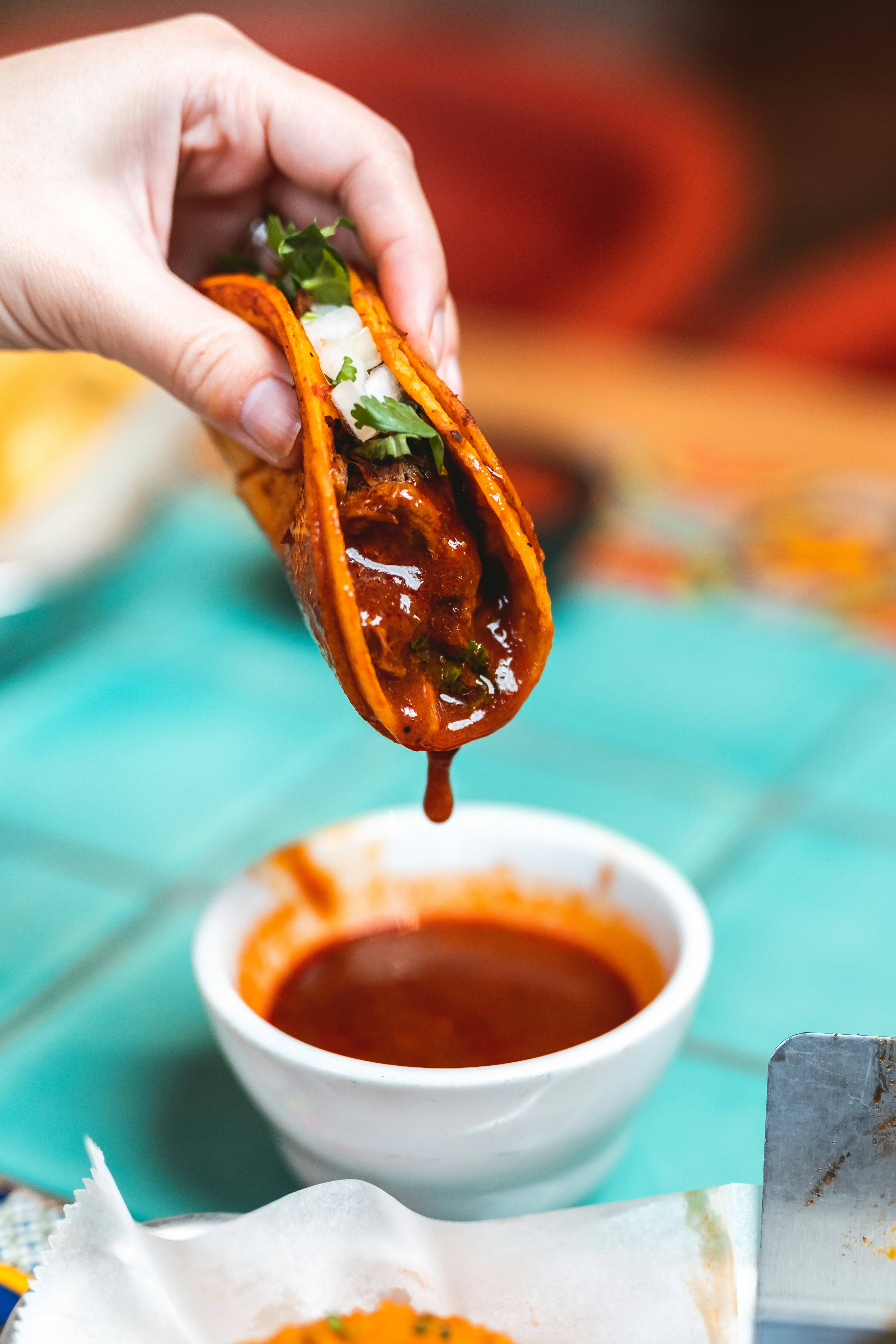 person holding brown sauce in brown sauce