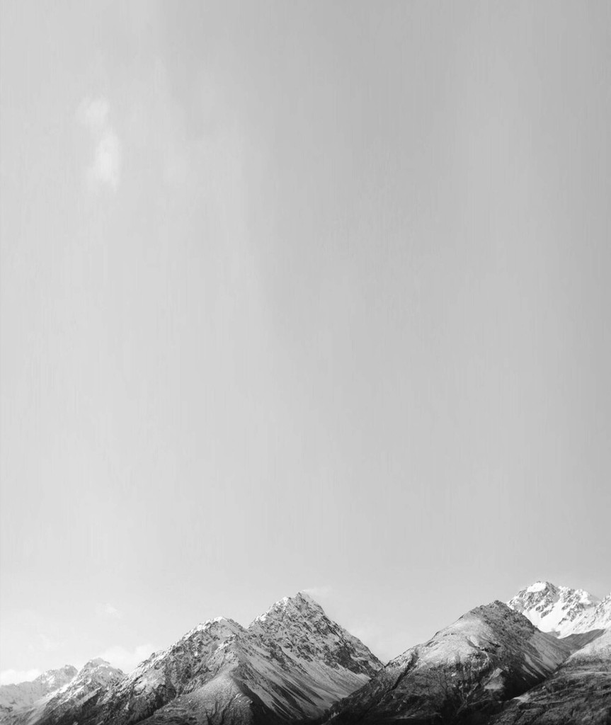 Mountain peaks emerging from haze at the bottom of the frame