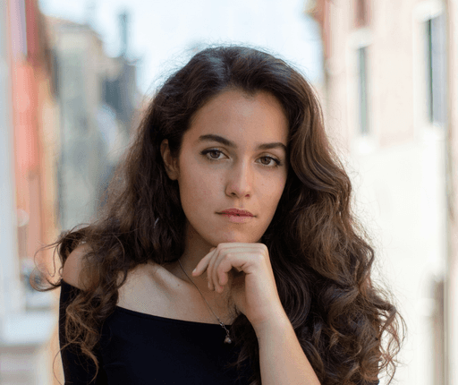 selective focus photography of woman wearing black off-shoulder blouse
