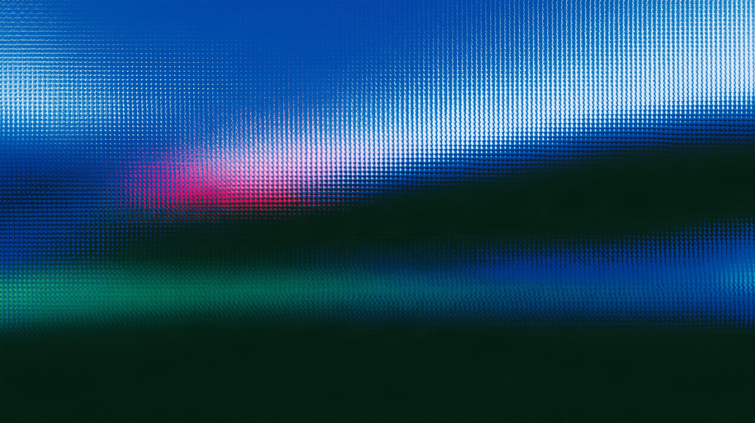 Abstract blue, green, and pink light patterns on a dark background