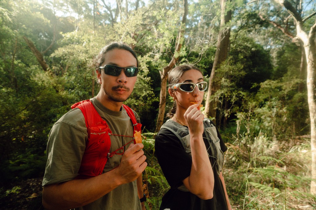Film image of two people standing in front of mountains