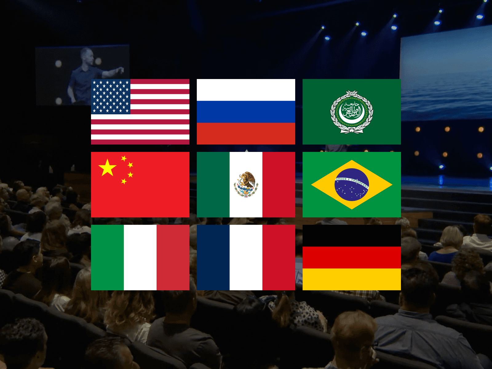International flag collage over a speaker presenting to a large auditorium audience
