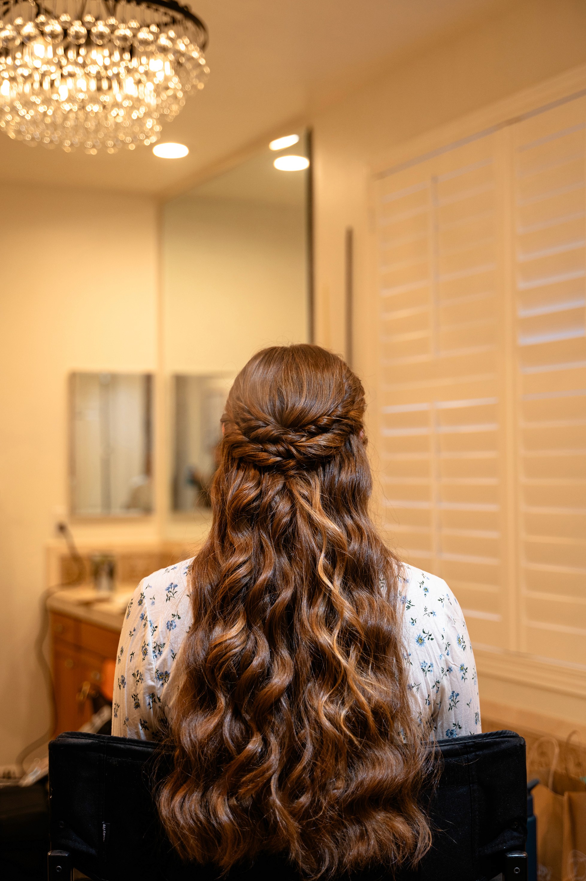 Flat lay wedding details with bouquet, rings, and sparkling bridal heels