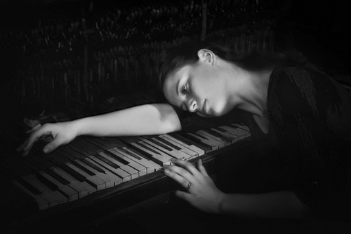 A stone brick path through a foggy forest
