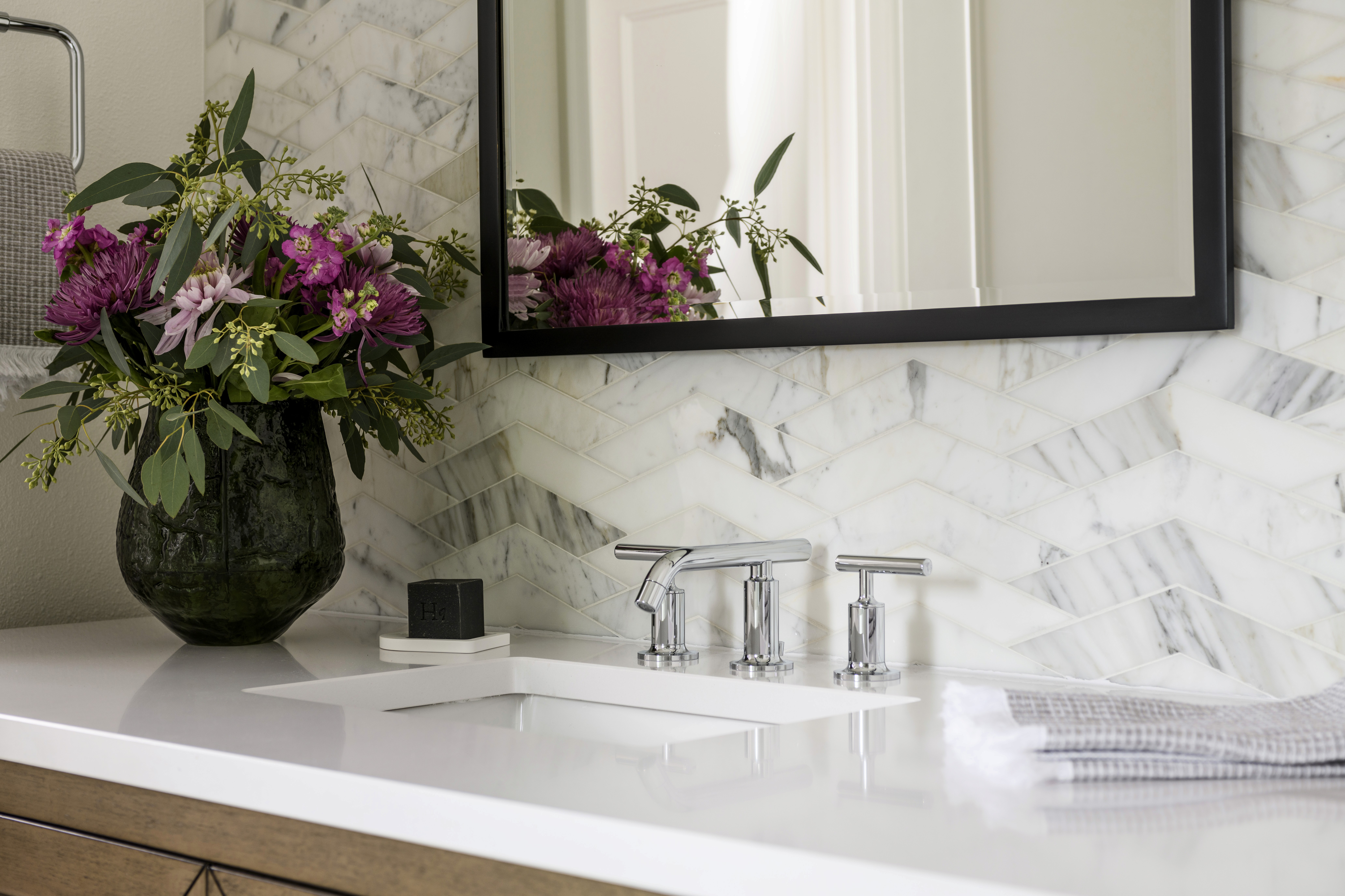 A beautiful remodeled bathroom in Issaquah, WA by Elegant Simplicity a full service interior designer.  Light bright and airy bedroom with modern cozy touches