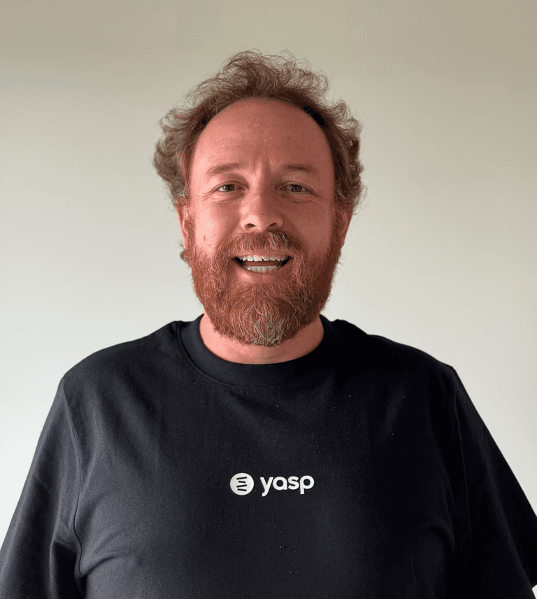 A woman with wavy hair is looking to the side.