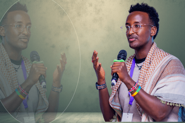 person in green blaze with a mic in their hand