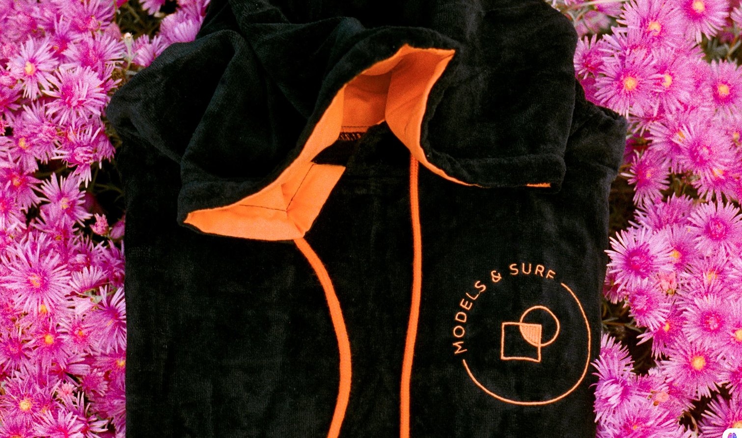 Logo apllied on a Surf Poncho Models and Surf