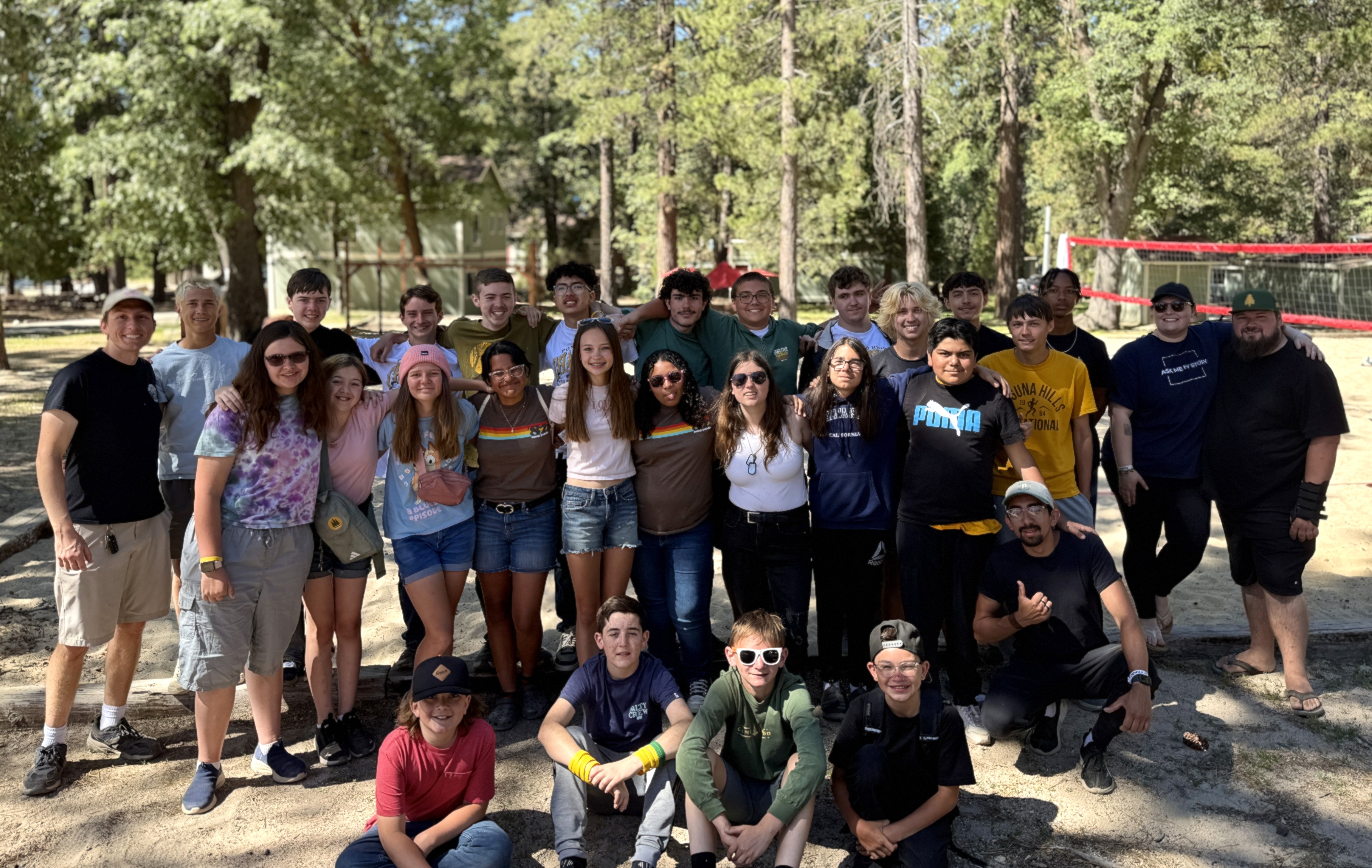 photography of five people near outdoor during daytime