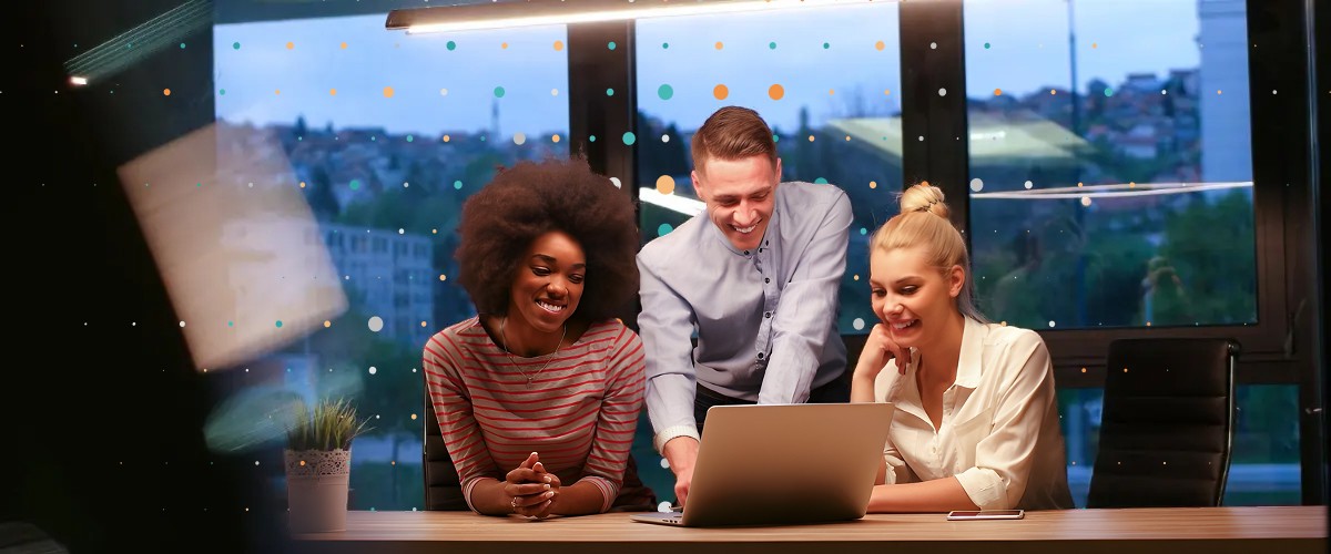 people looking at a laptop