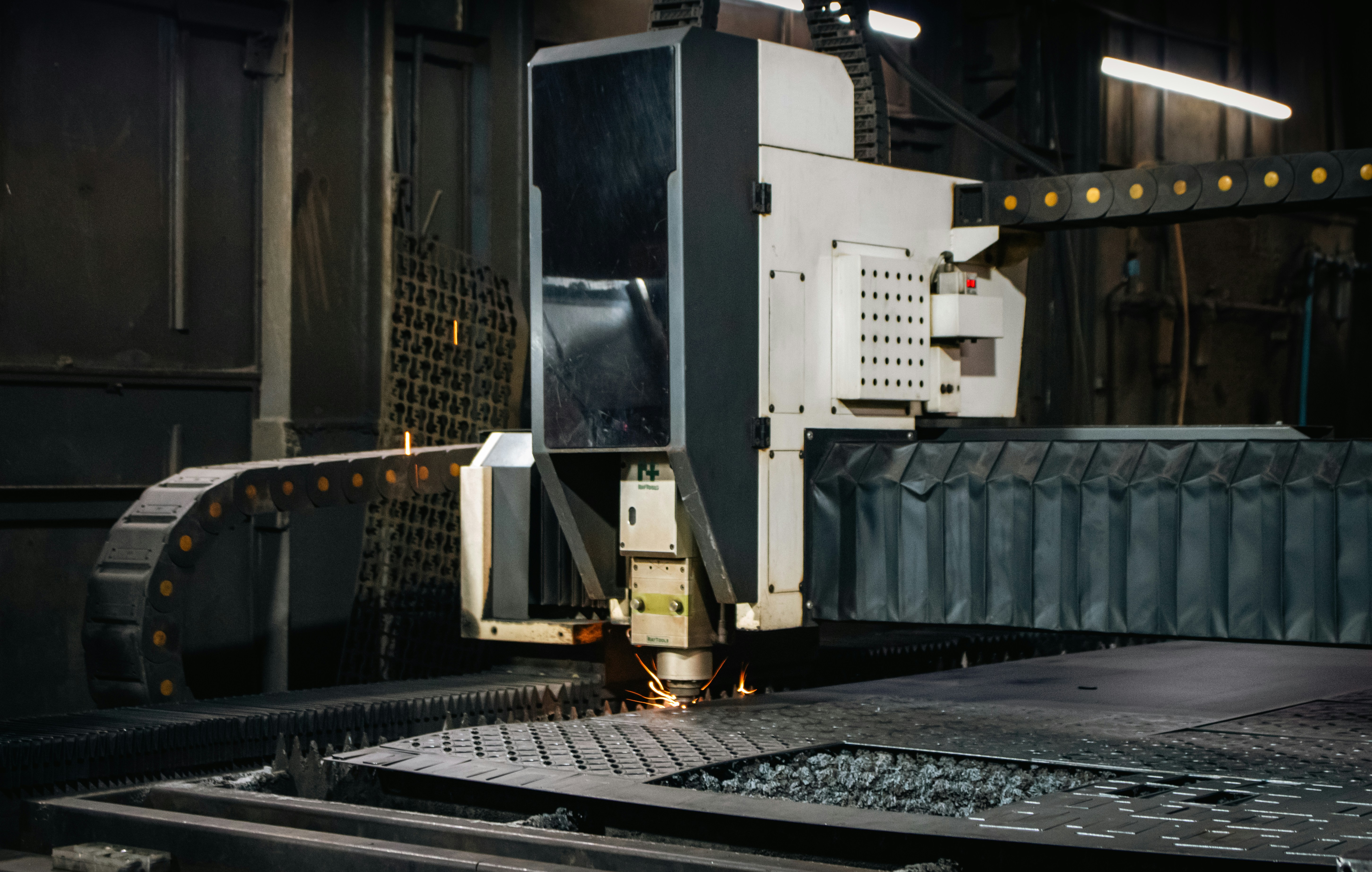 Industrial laser cutter working on metal sheet
