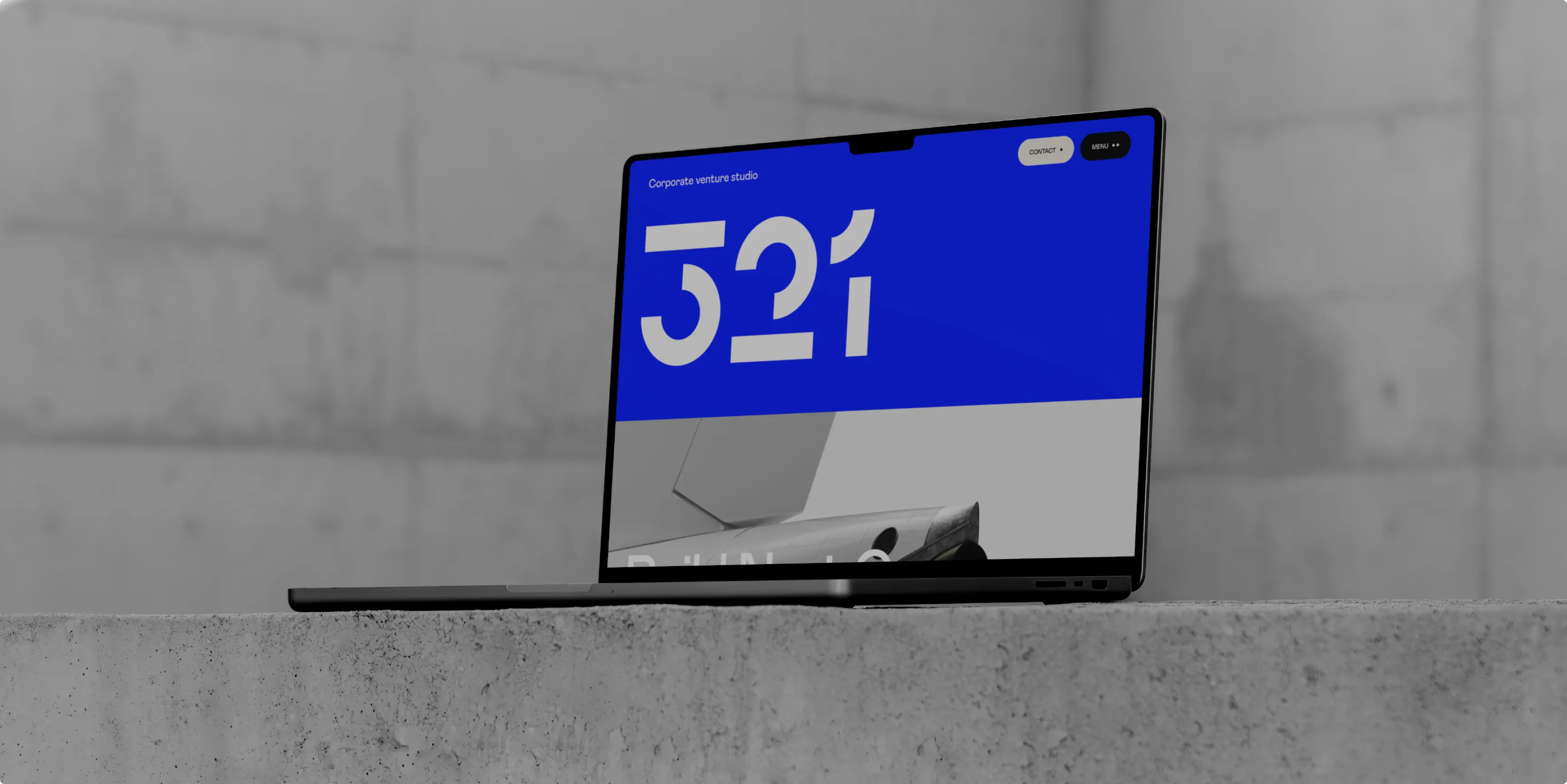Blue digital display showing the number 321 mounted on a gray wall.