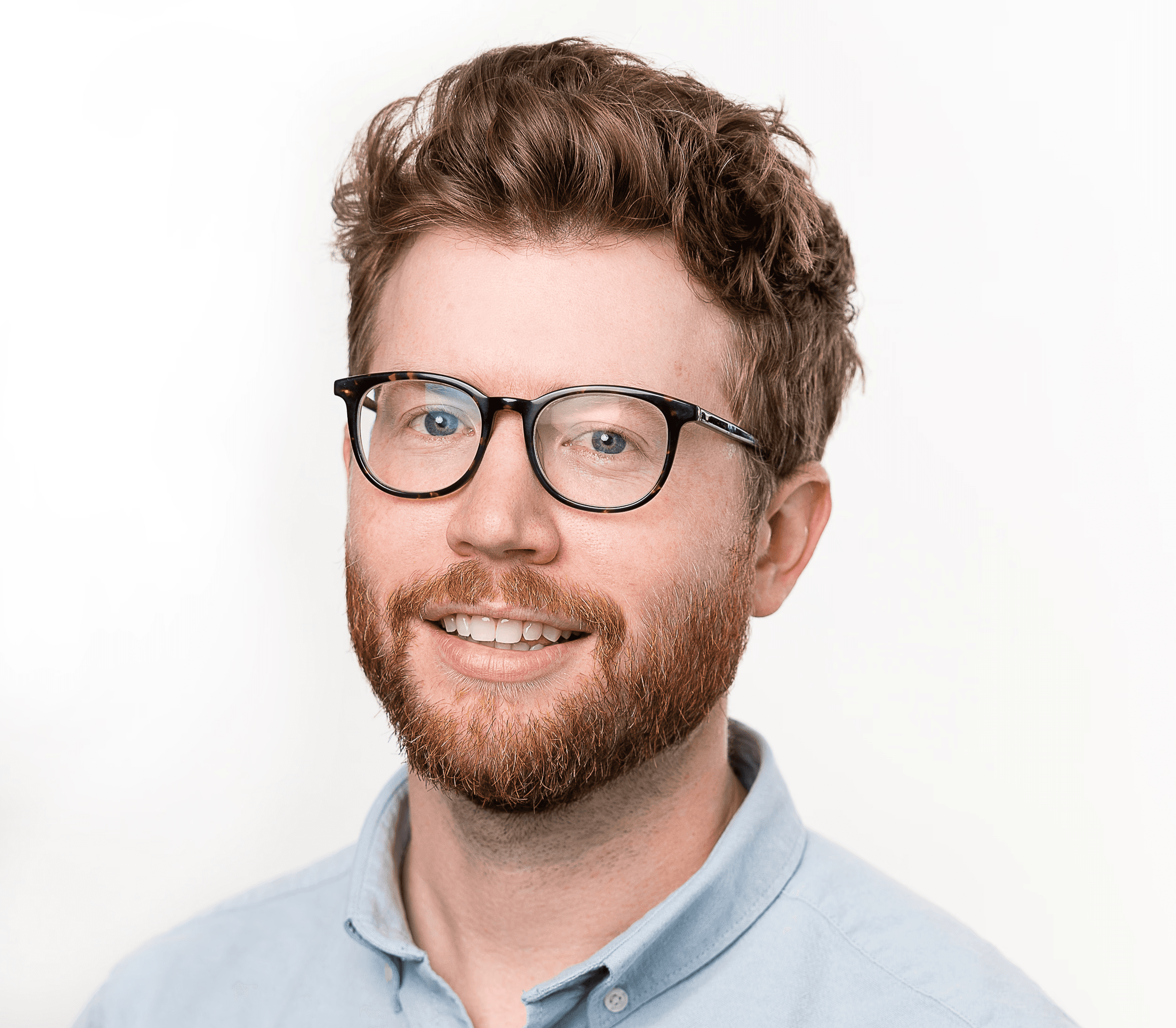 Close-up of a yellow tennis ball sitting on a green court, positioned near the white center line.