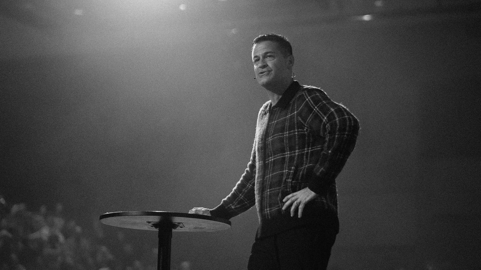 two people looking at a tablet and smiling