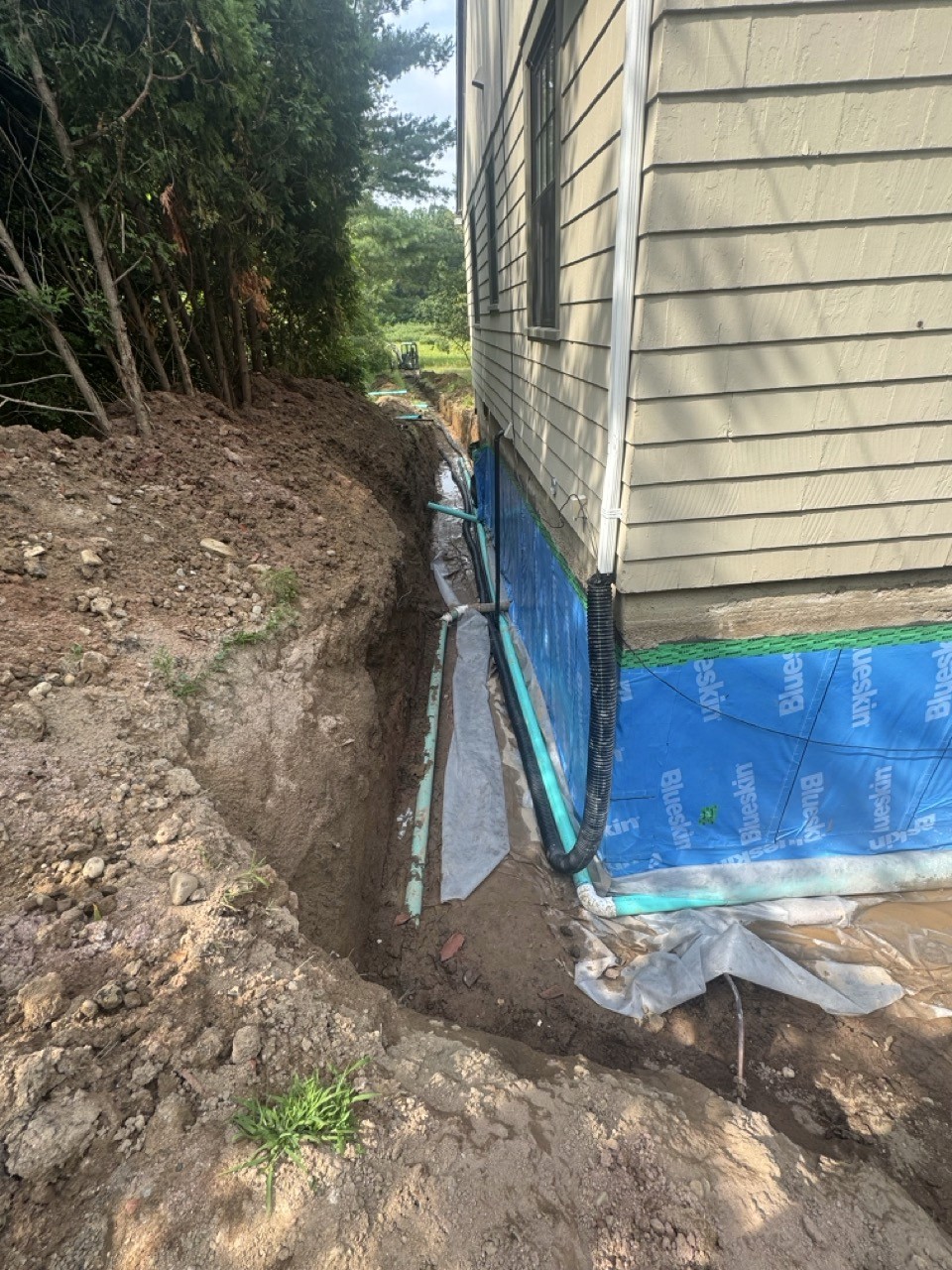 Foundation waterproofing and footing drain at a home addition, by A&M Construction Enterprises
