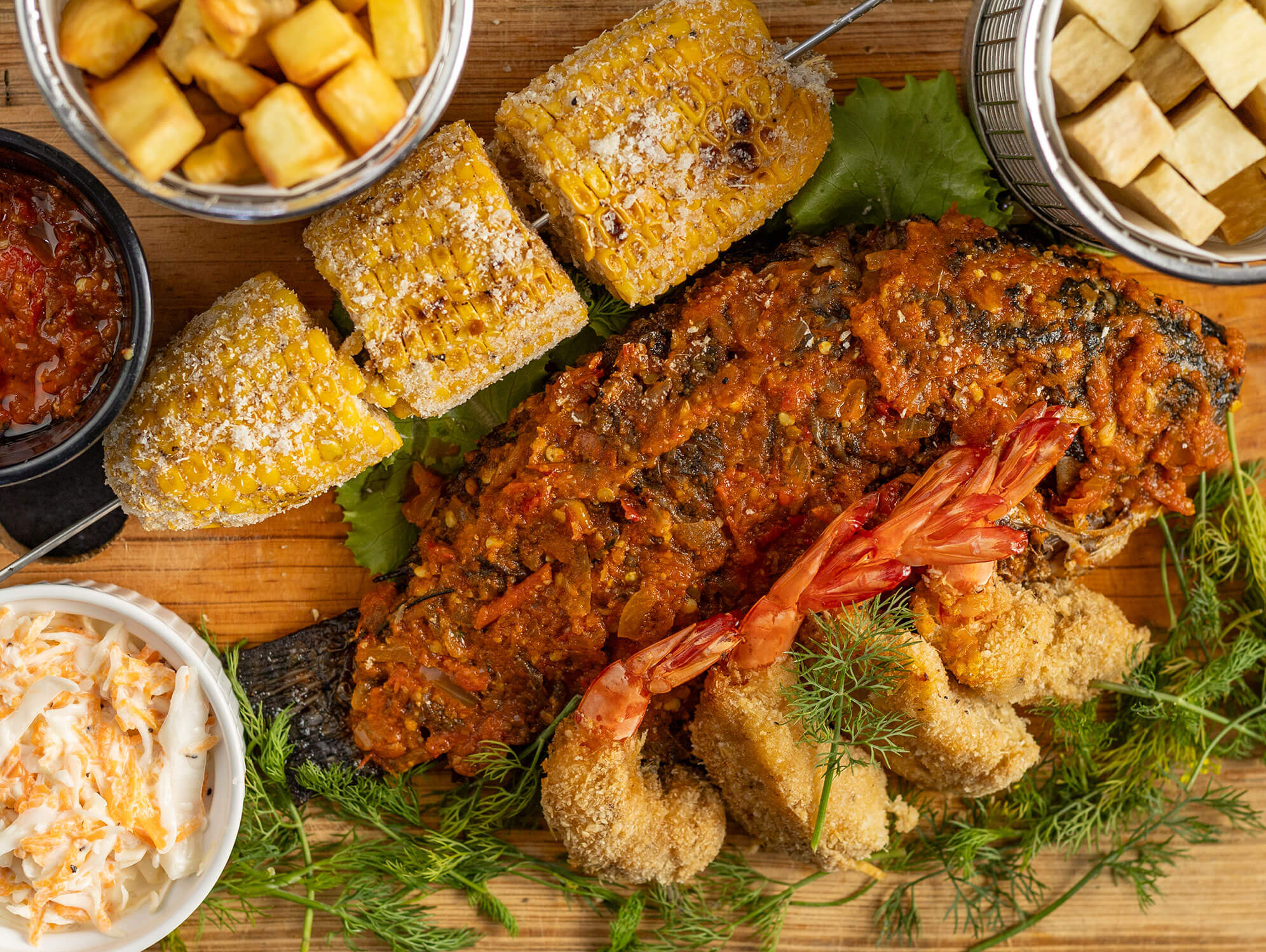 traditional famous and delicious injera served at Yajee, displayed with a variety of flavorful accompaniments on a large platter.