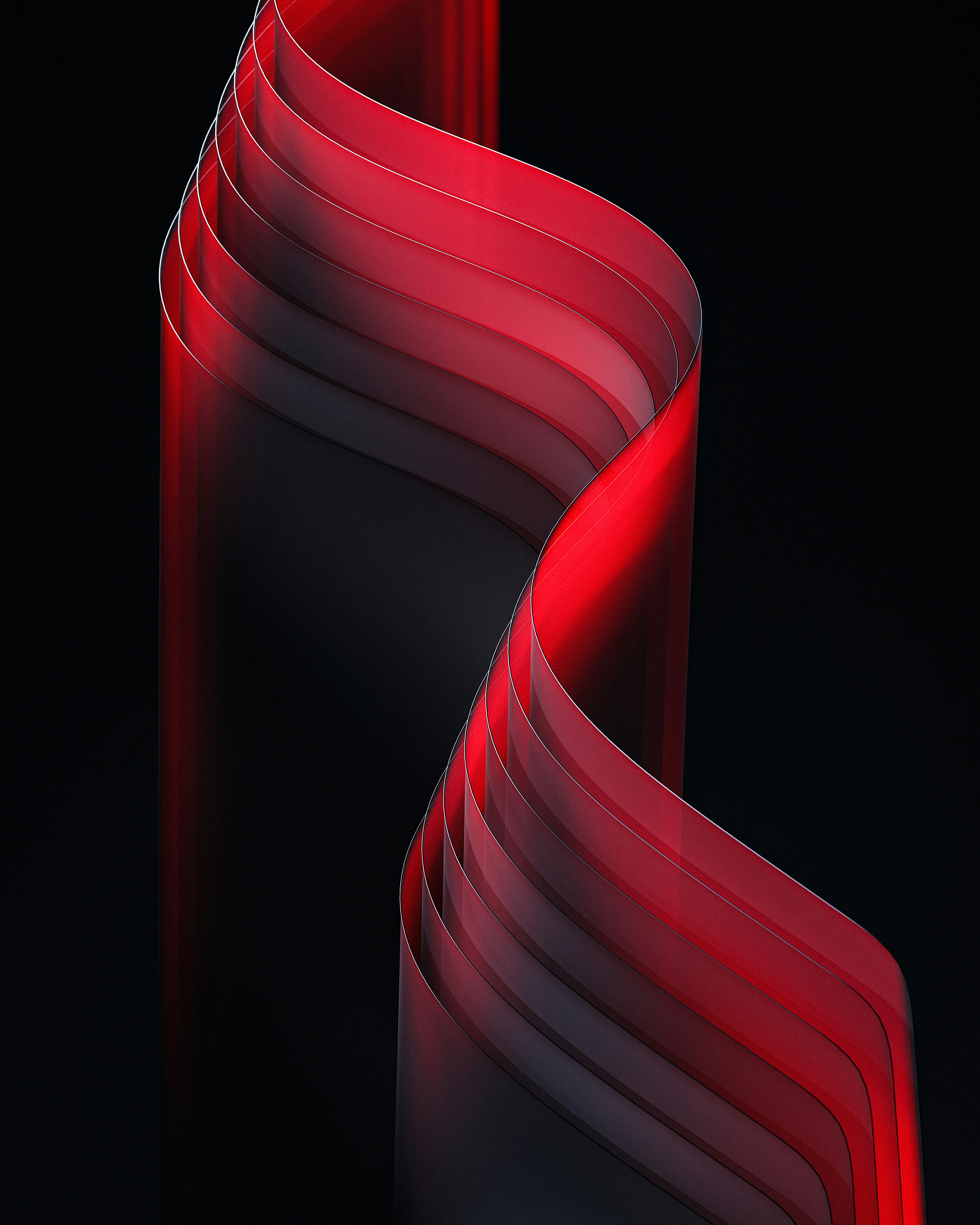 a group of red curved objects on a black background