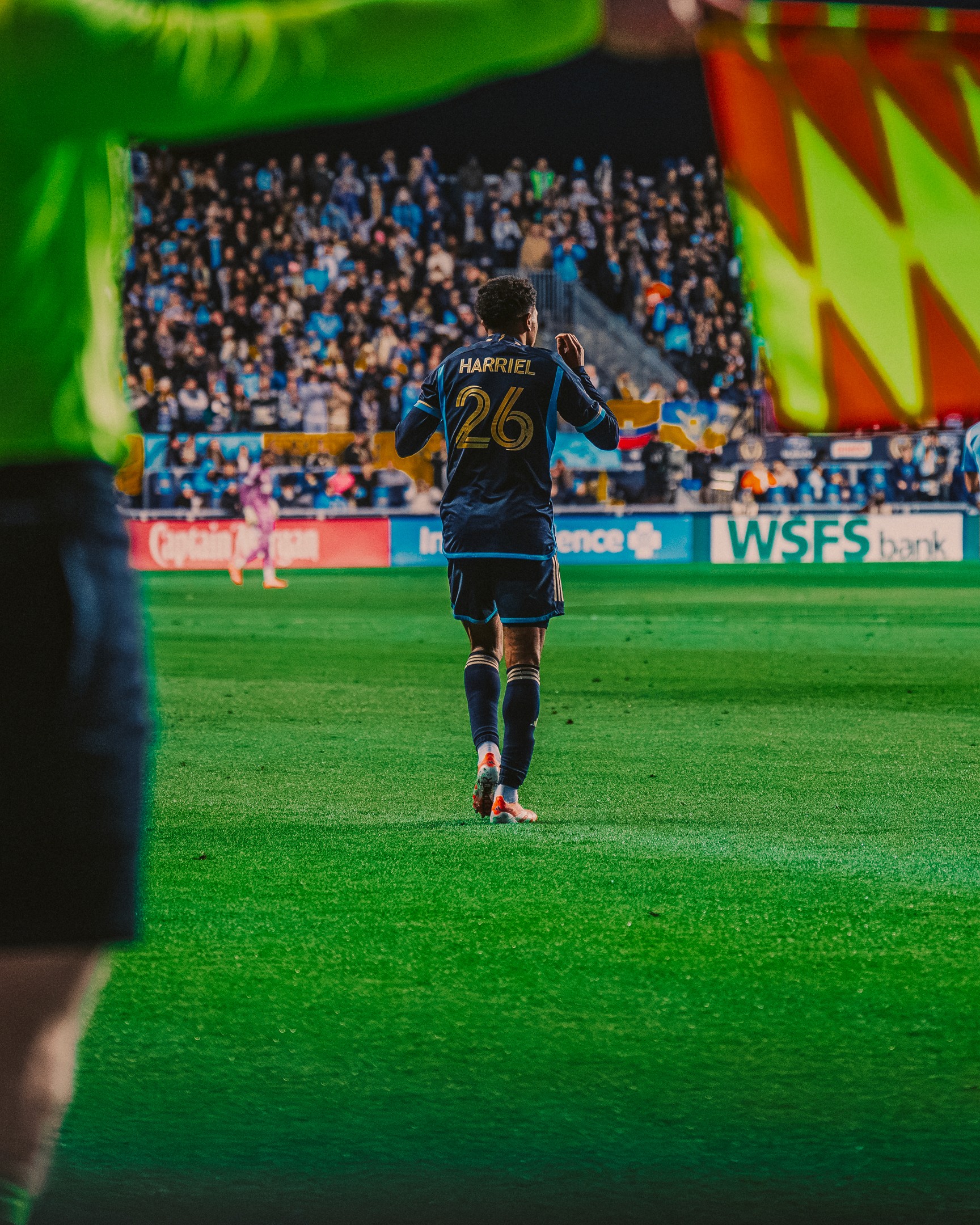 Close-up of a camera lens with a small aperture opening