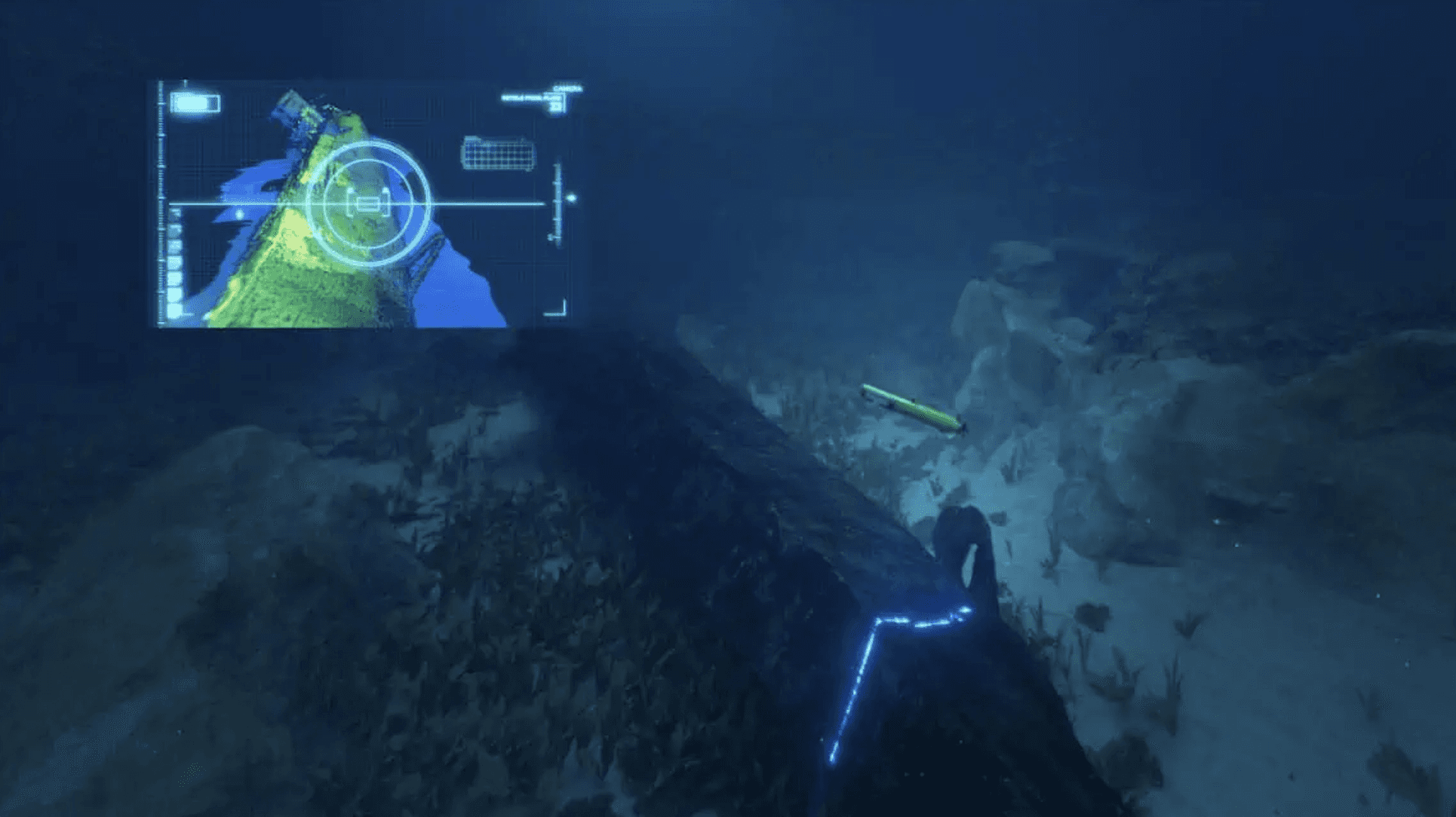 Person in submarine looking out large window at sea.