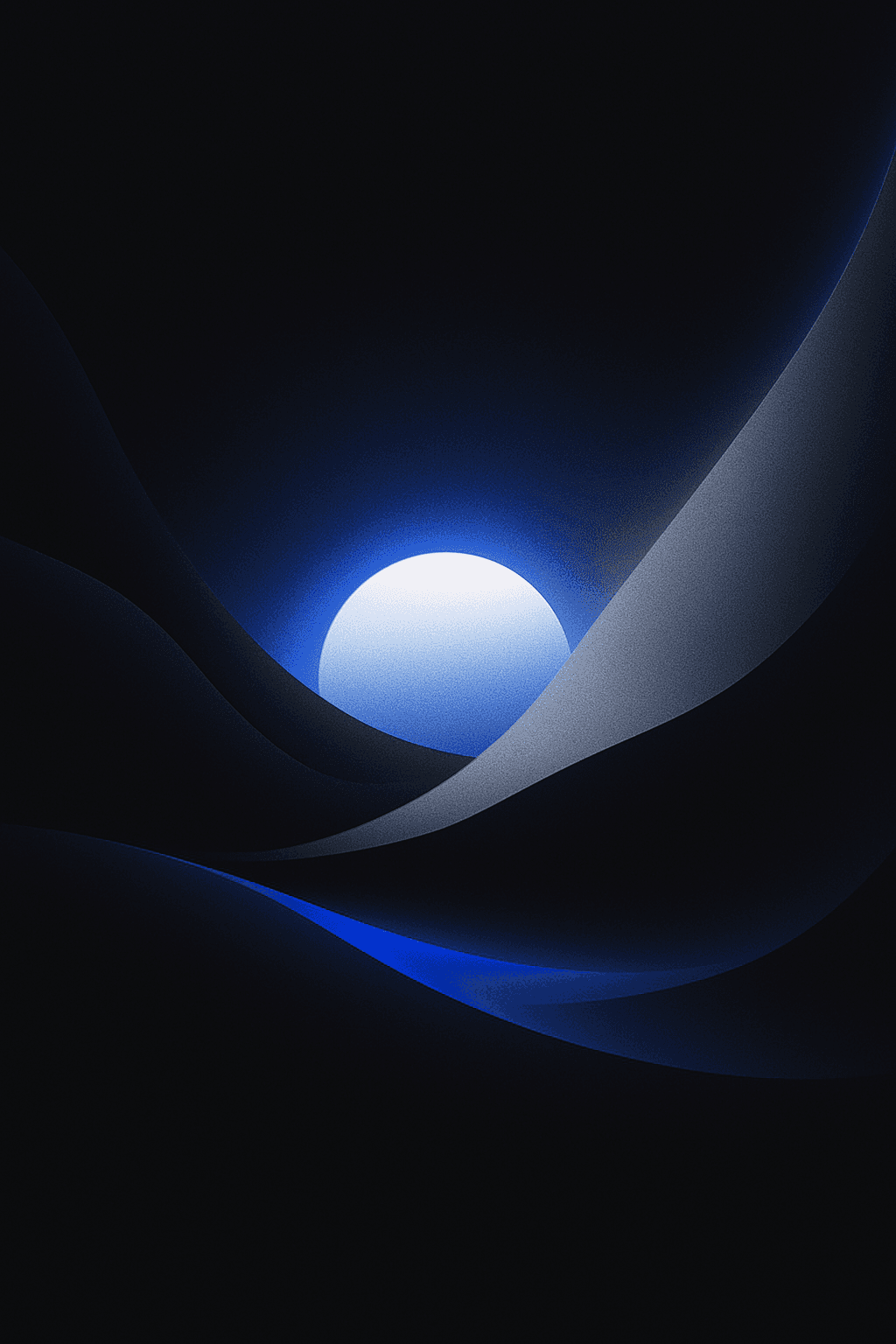 Man sitting in a dimly lit room, wearing a beige shirt and looking contemplative.