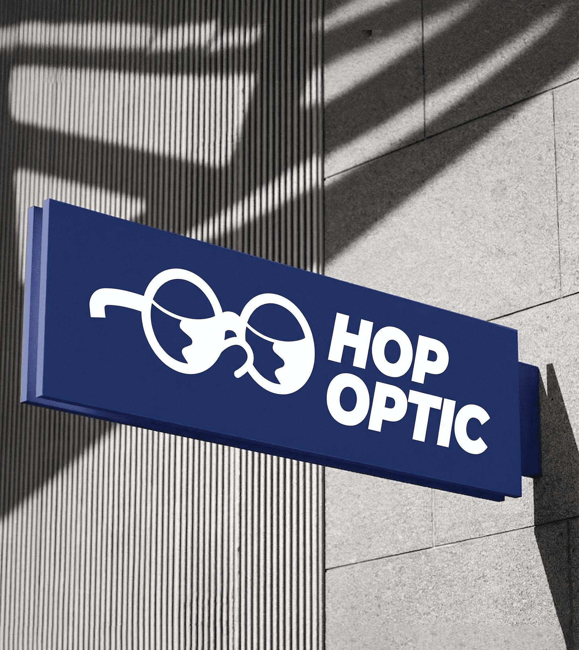 Close-up of a yellow tennis ball sitting on a green court, positioned near the white center line.