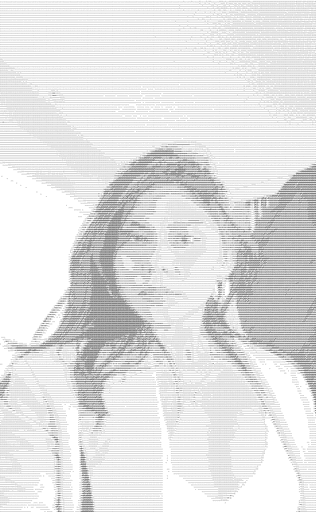 A thoughtful young person with dark hair gazes to the side, captured in soft black and white lighting.