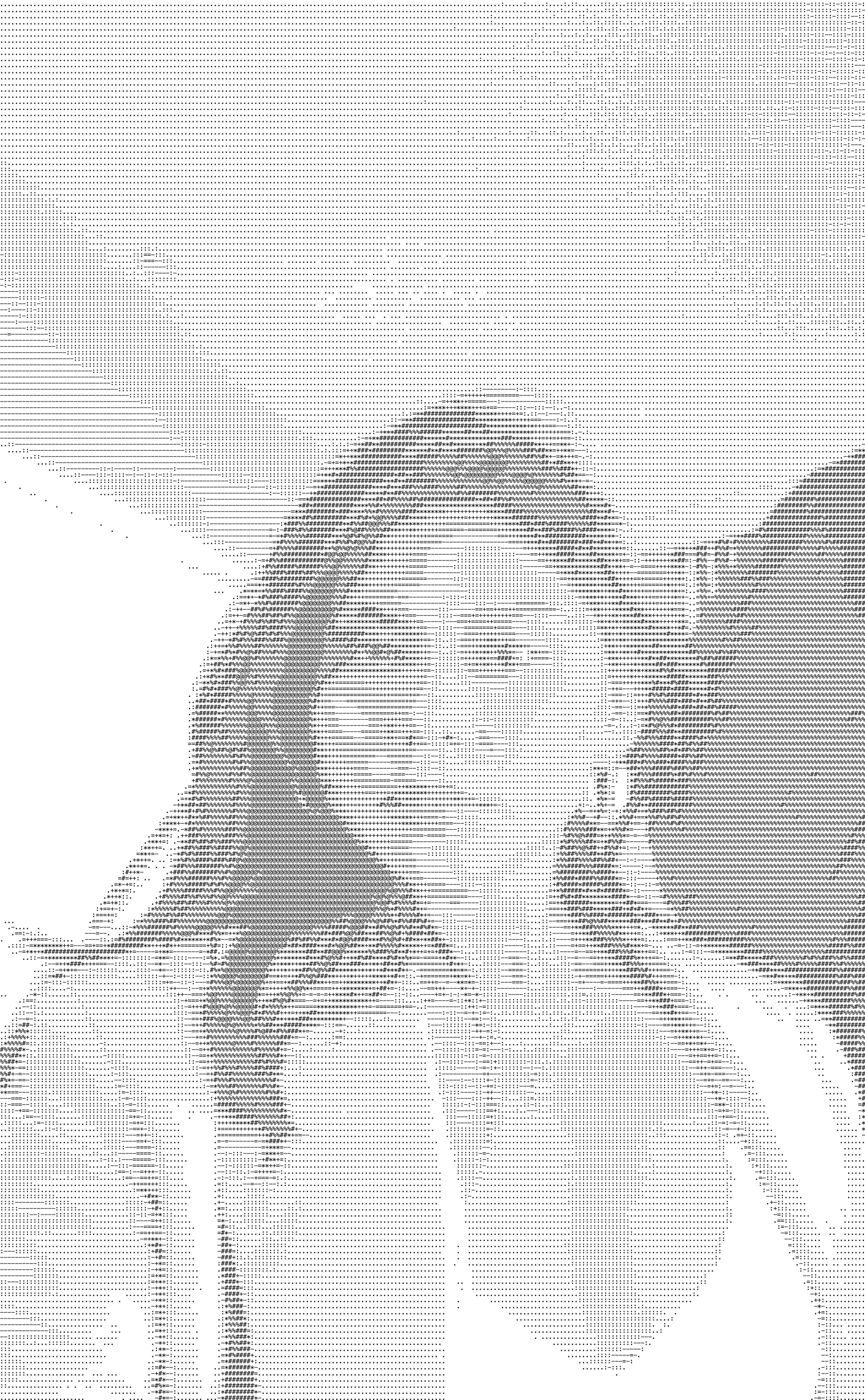 A thoughtful young person with dark hair gazes to the side, captured in soft black and white lighting.