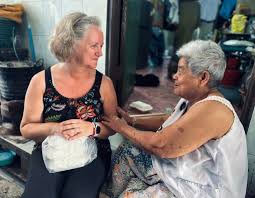 man in black crew neck t-shirt wearing black framed sunglasses
