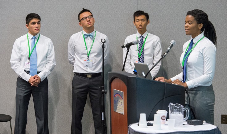 The 2014 UCSD Software iGEM team presenting SBiDer (Synthetic Biocircuit Developer), a web-tool that leverages existing genetic devices to create complex genetic circuits. Photo: iGEM Foundation, Justin Knight.