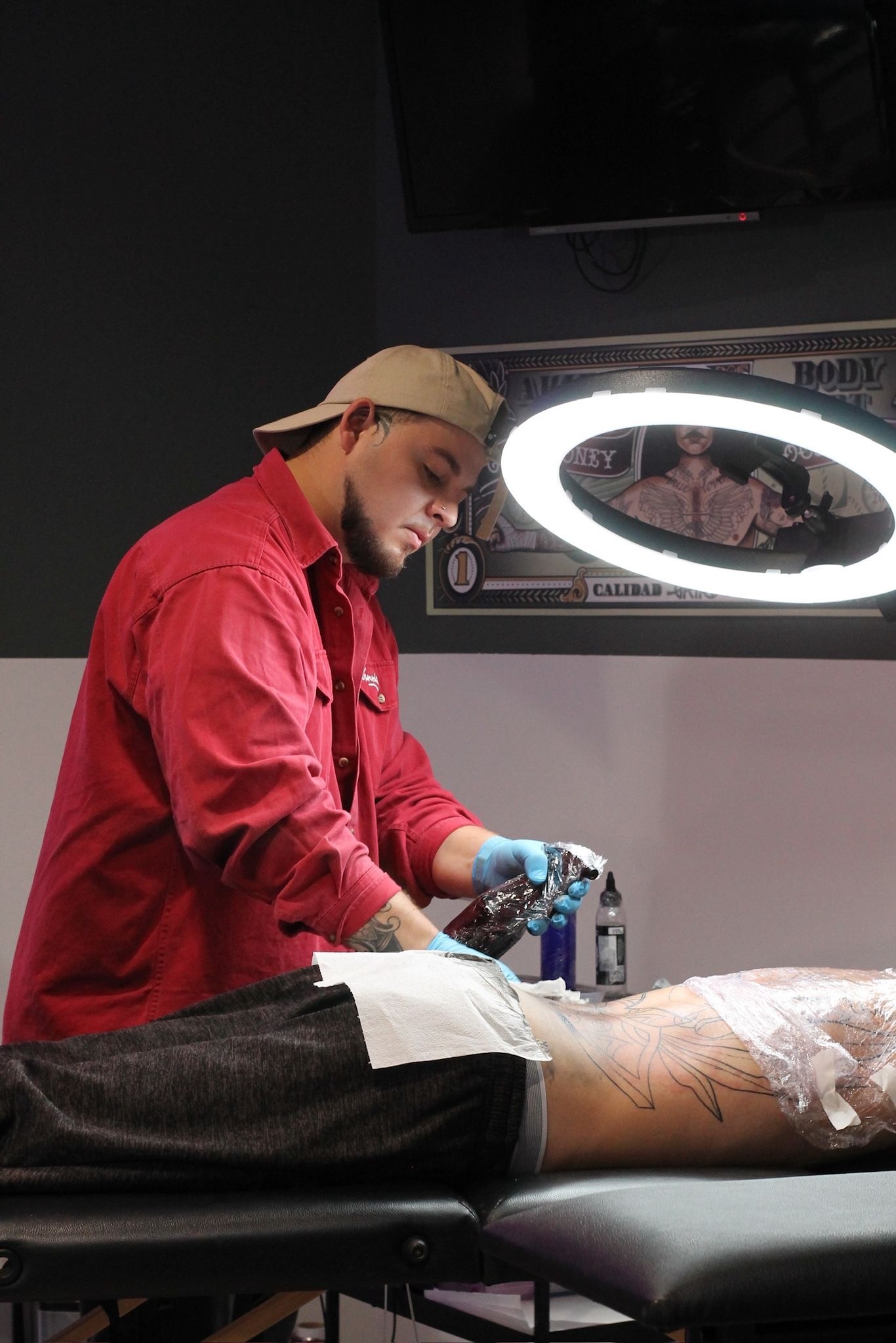 A thoughtful young person with dark hair gazes to the side, captured in soft black and white lighting.