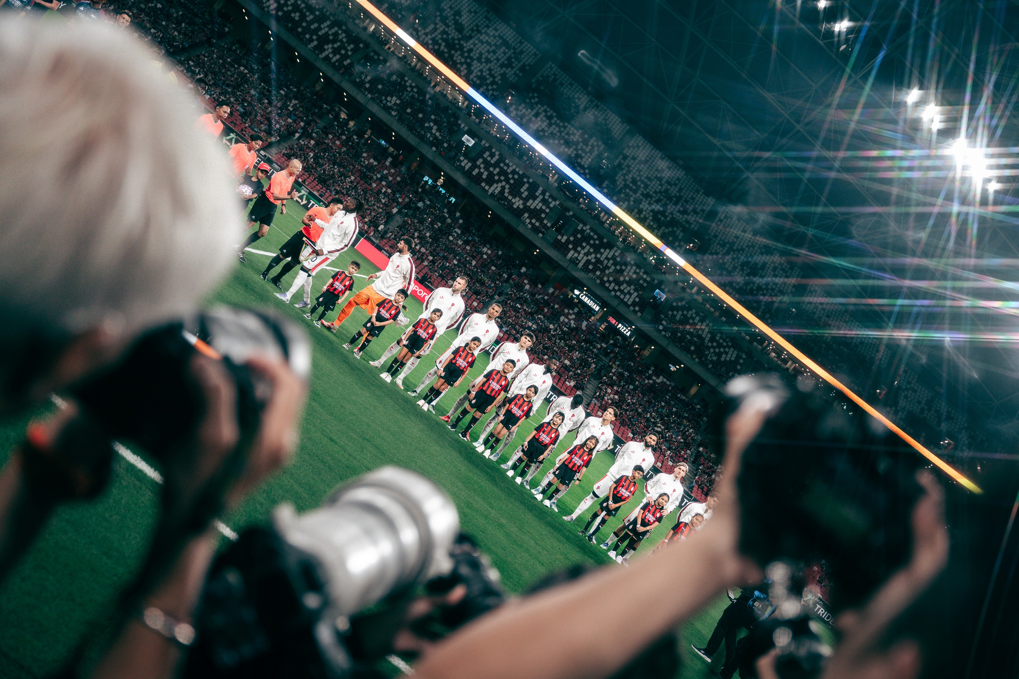 A.C. Milan players get ready during a match between Arsenal and A.C. Milan at the National Stadium in Singapore for the Singapore Festival of Football 2025