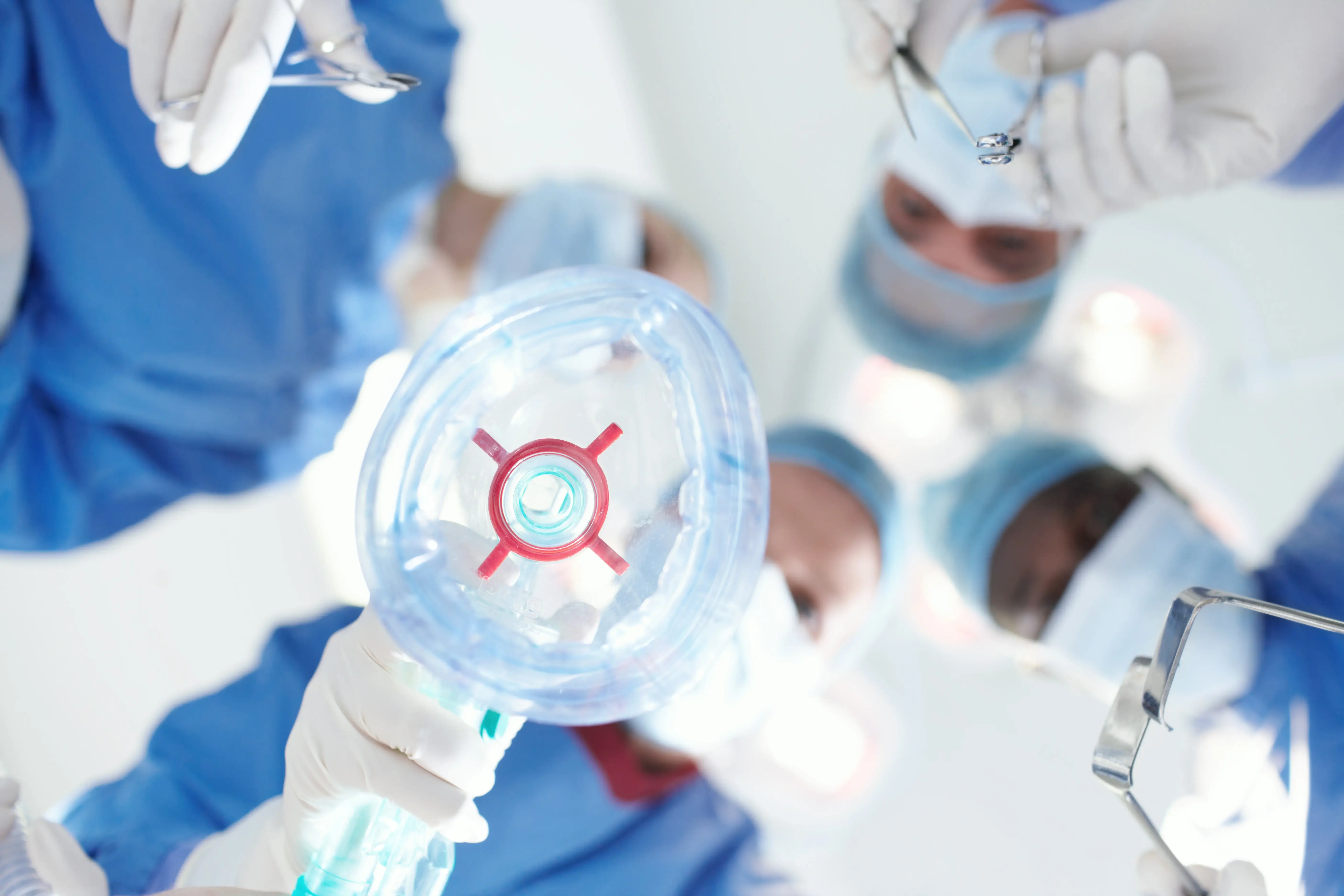 Orthopaedic surgical team performing a procedure in a modern operating theatre