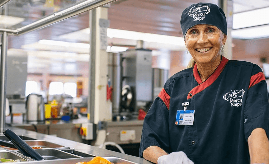 Woman serving in the cafeteria