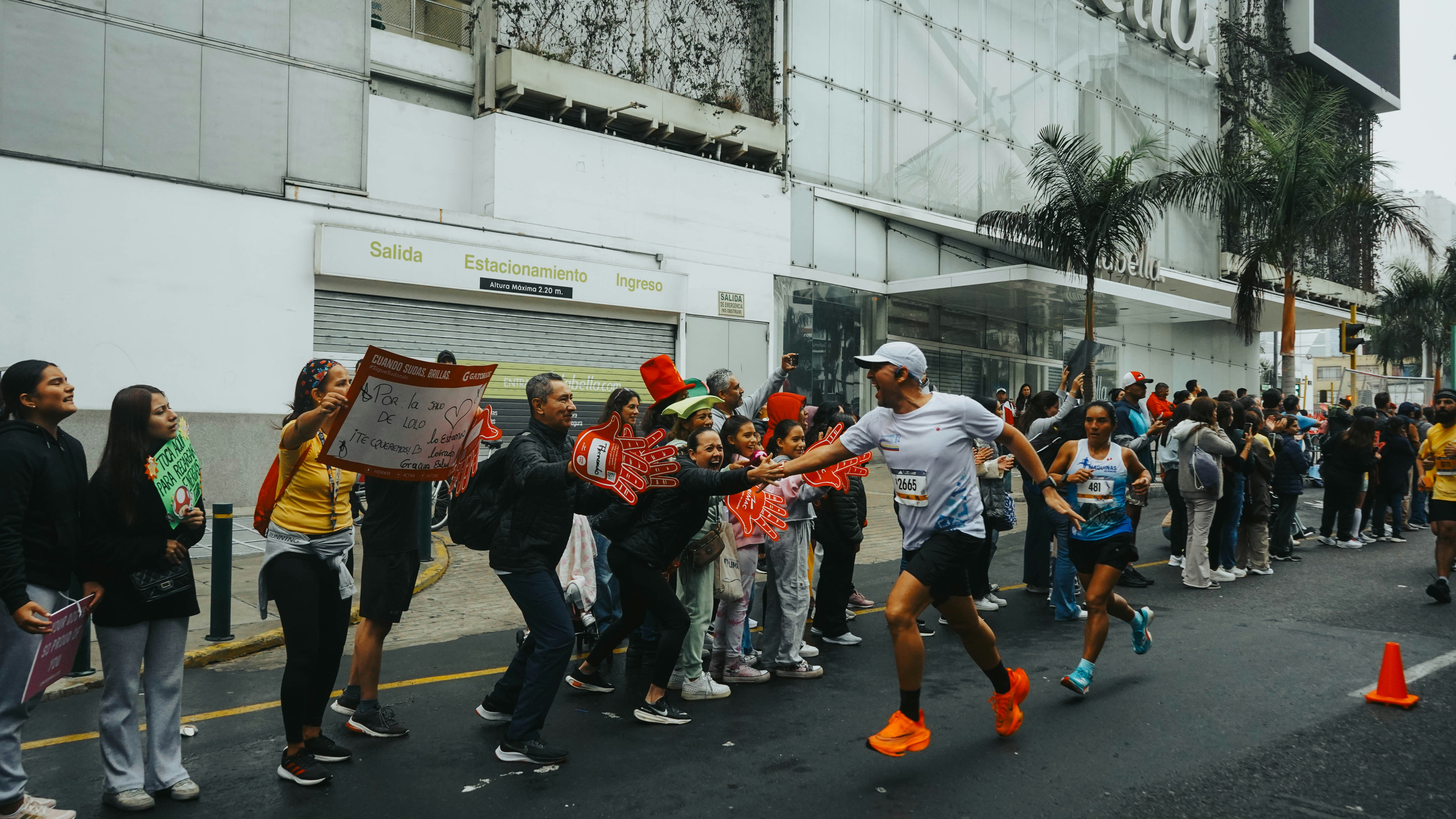 A group of people standing on the side of a road