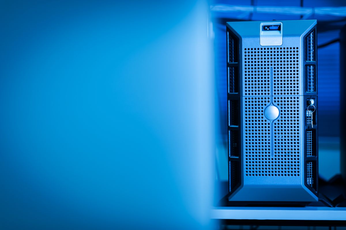 A blue-lit server in a data center room