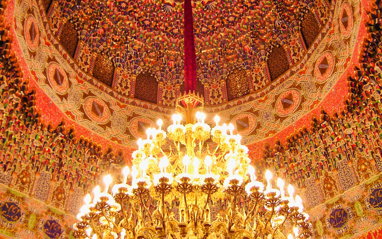 Ornate ceiling and chandelier in the Royal Palace of Aranjuez, Spain.