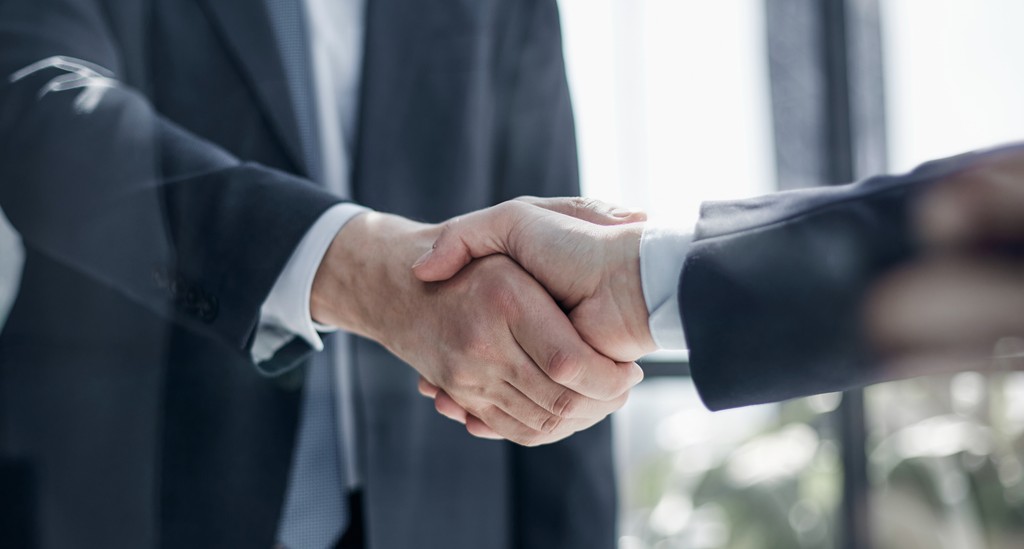 person writing on a piece of paper