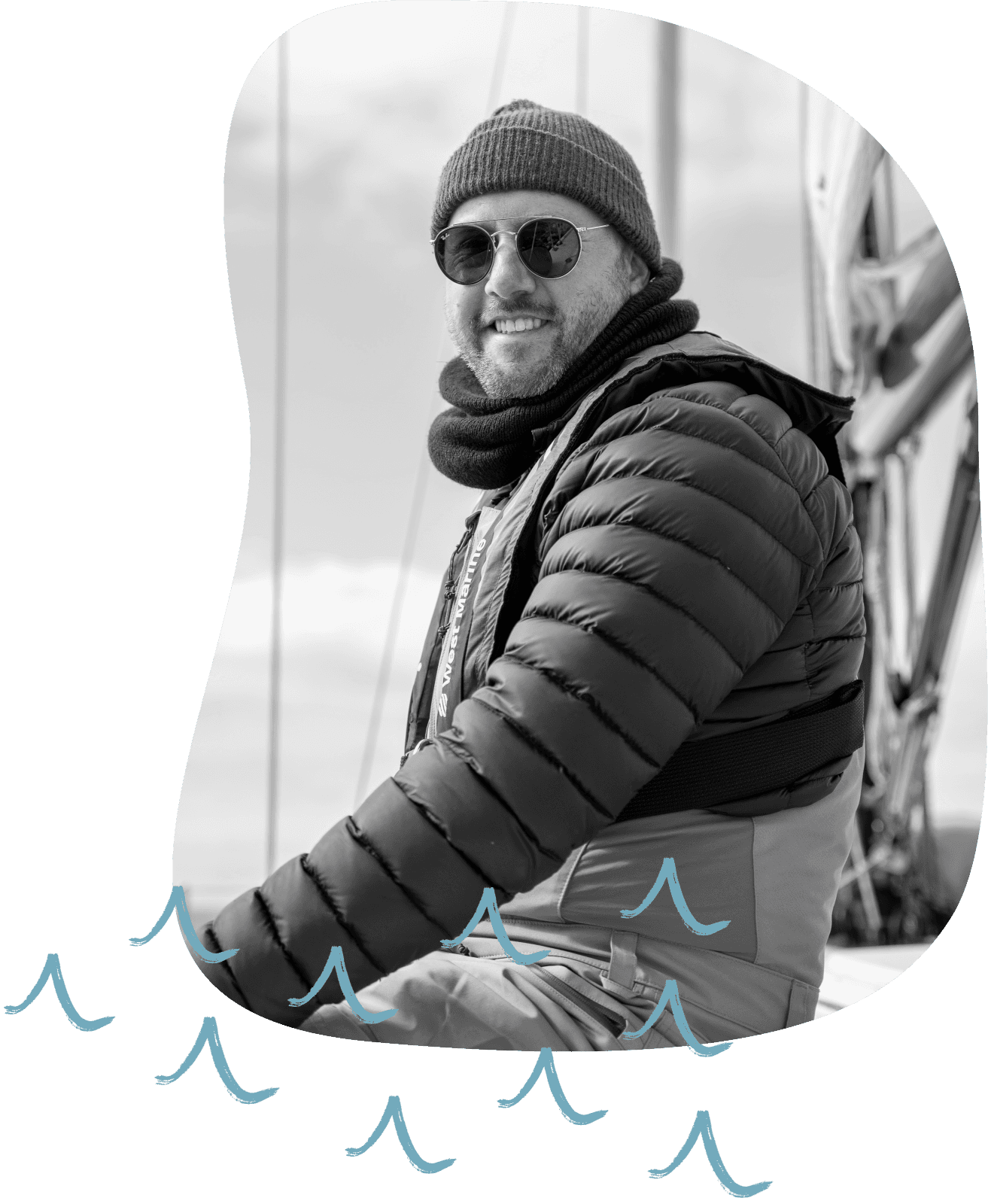 Scott on a sailboat with illustrated waves drawn over the picture