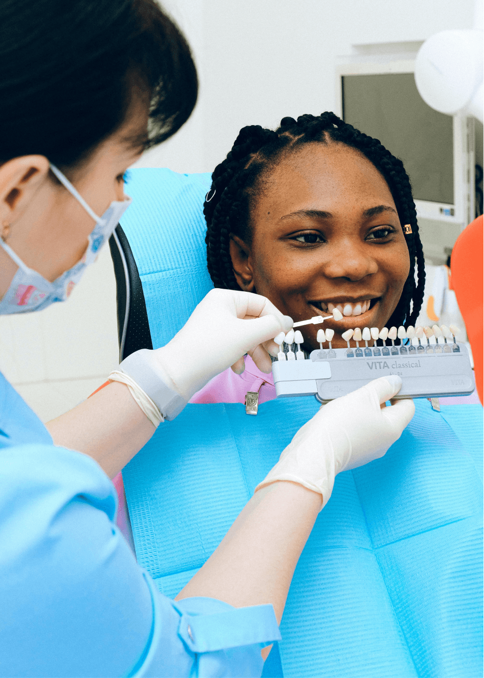 a dentist in davao showing veneers to a patient