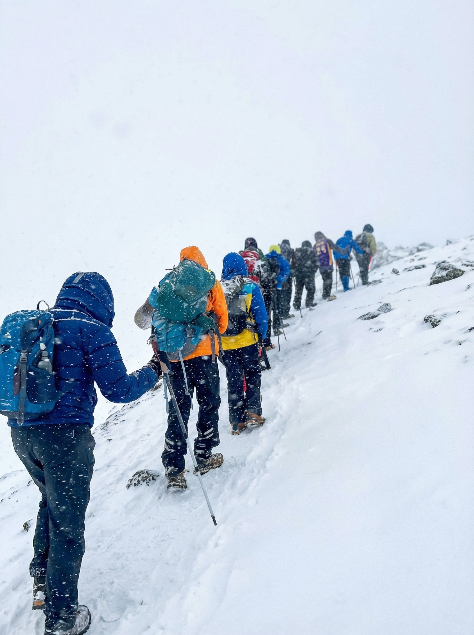 Traditional Arabic setup with chairs and lanterns in the desert sands of AlUla during sunrise.