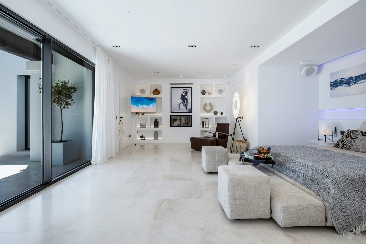 Master suite fireplace at exclusive luxury villa Ibiza, private VIP holiday retreat.