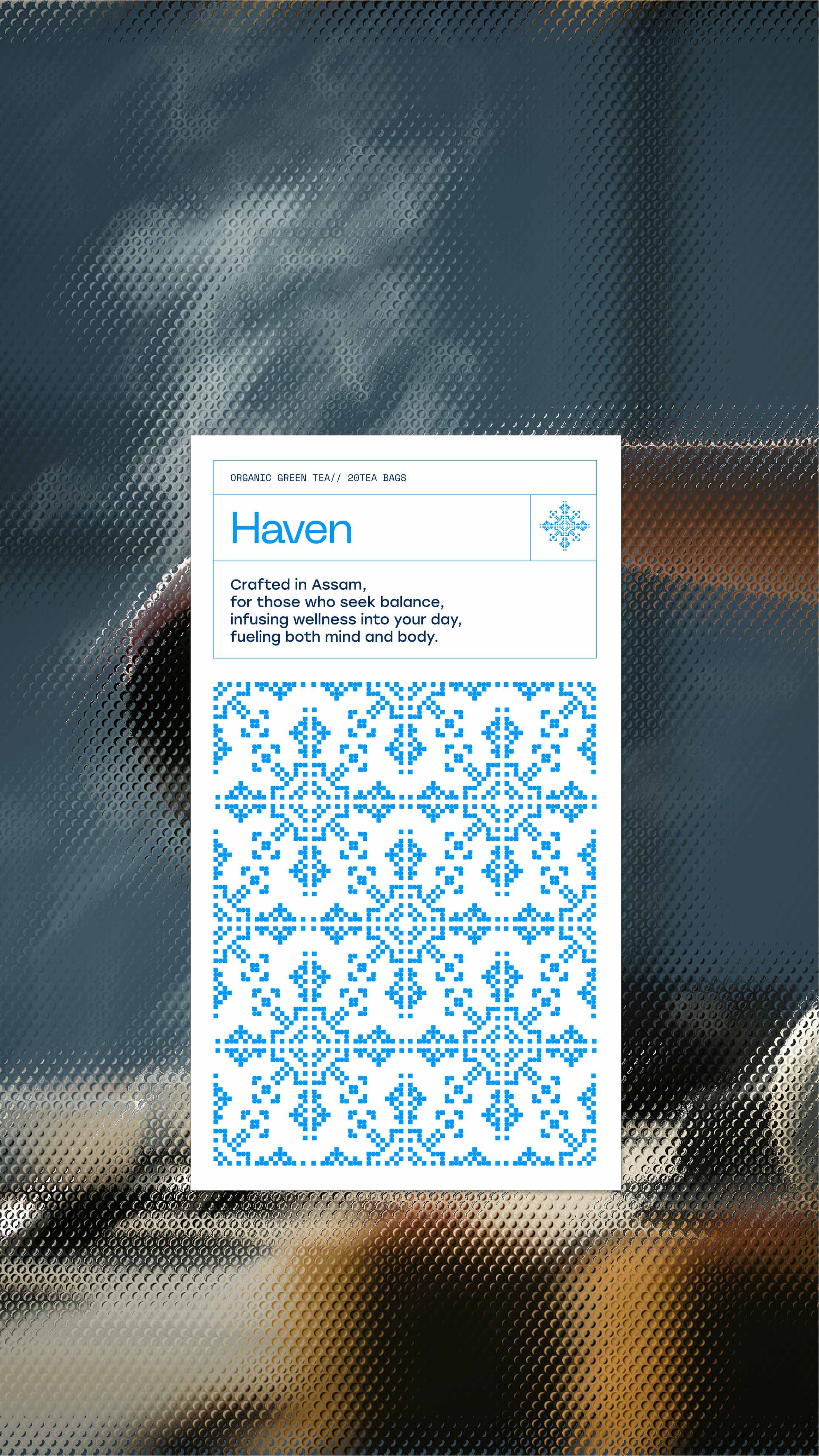 A white card with blue geometric patterns and the word "Haven" is displayed, offering a description that promises balance and rejuvenation, set against a blurred background of a cozy, steam-filled environment.