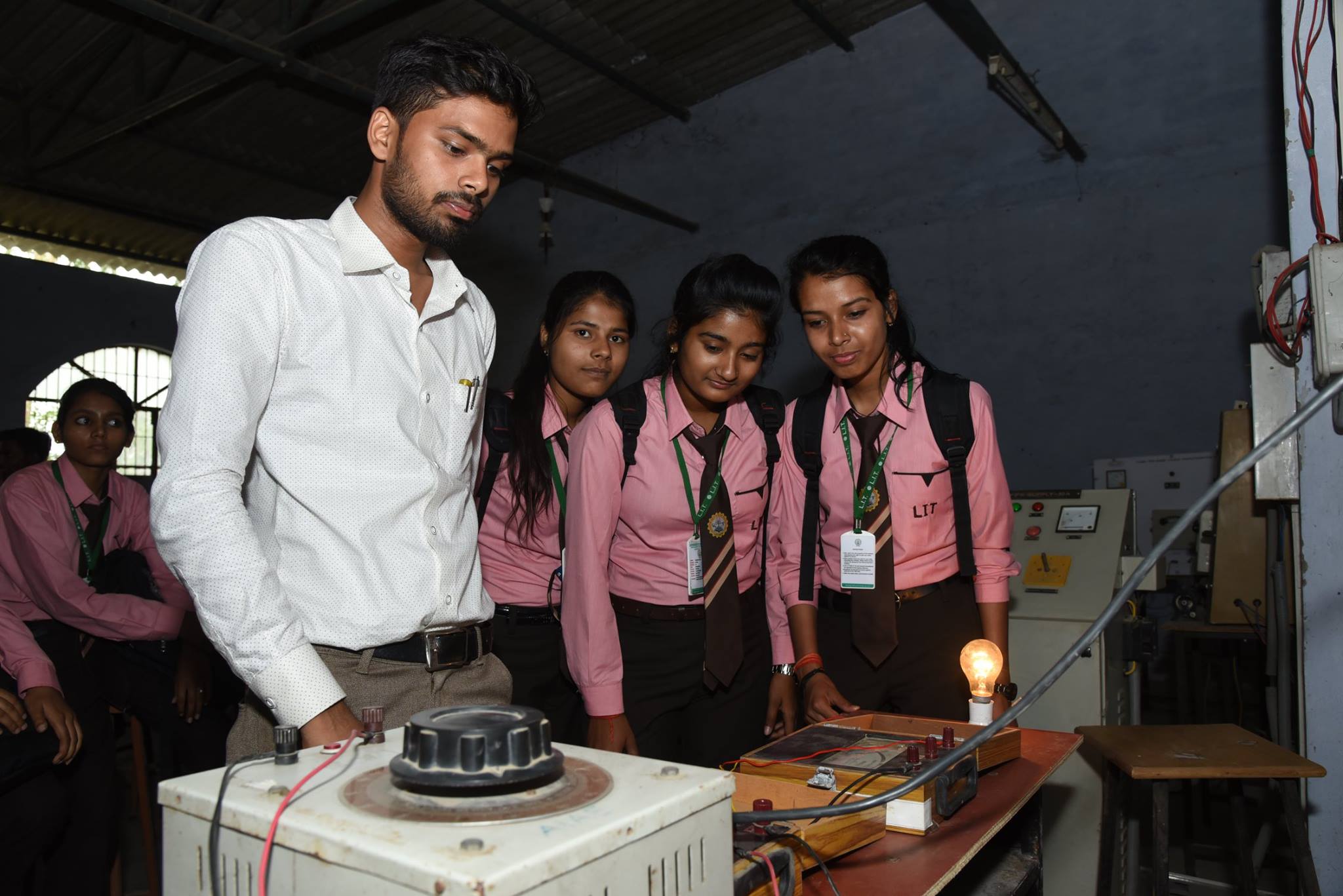 Full moon rising behind a house at night
