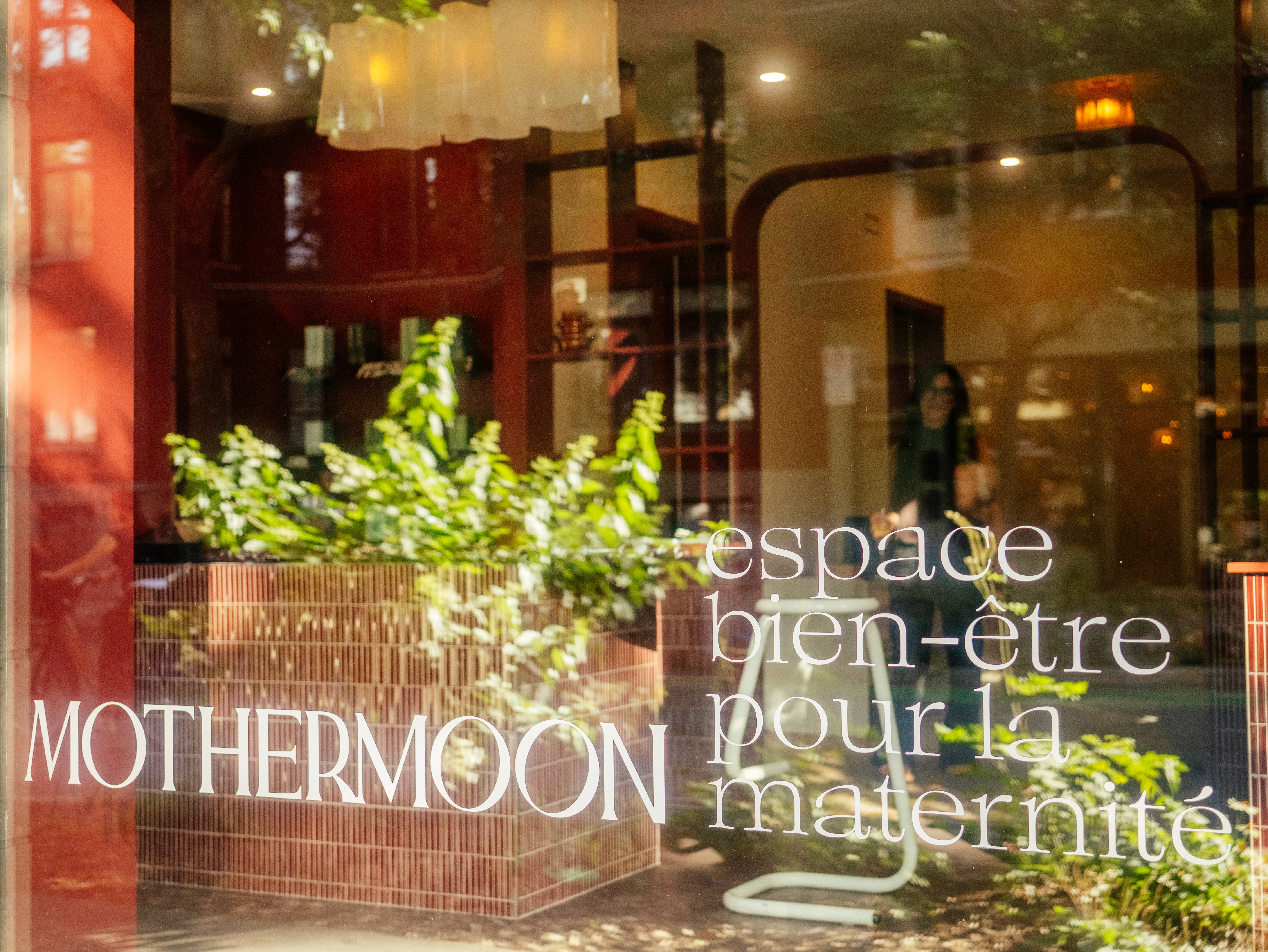 Mothermoon wellness spa: framed black-and-white portrait print with logotype — maternal wellness brand identity by Willda Design Studio, Berlin