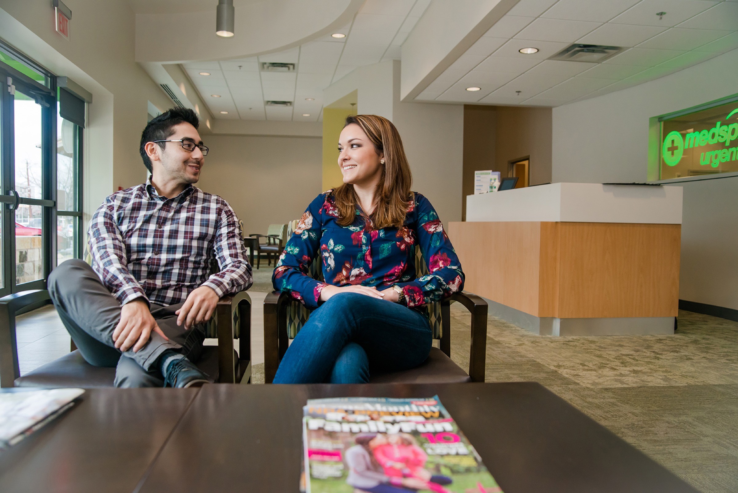 Two colleagues talking in a medical workplace