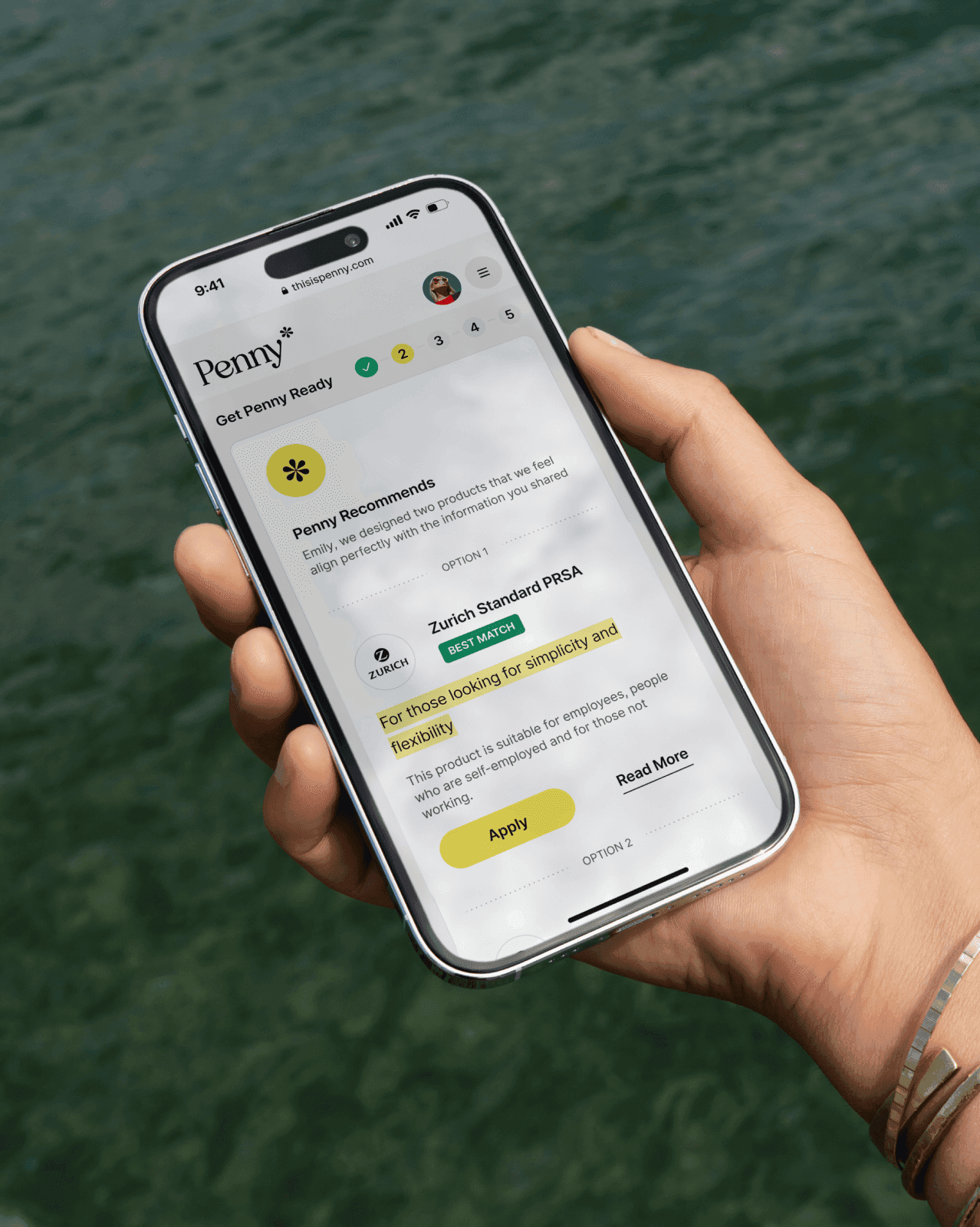 Hand holding a smartphone displaying the Penny app's recommendation for a Zurich Standard PRSA plan