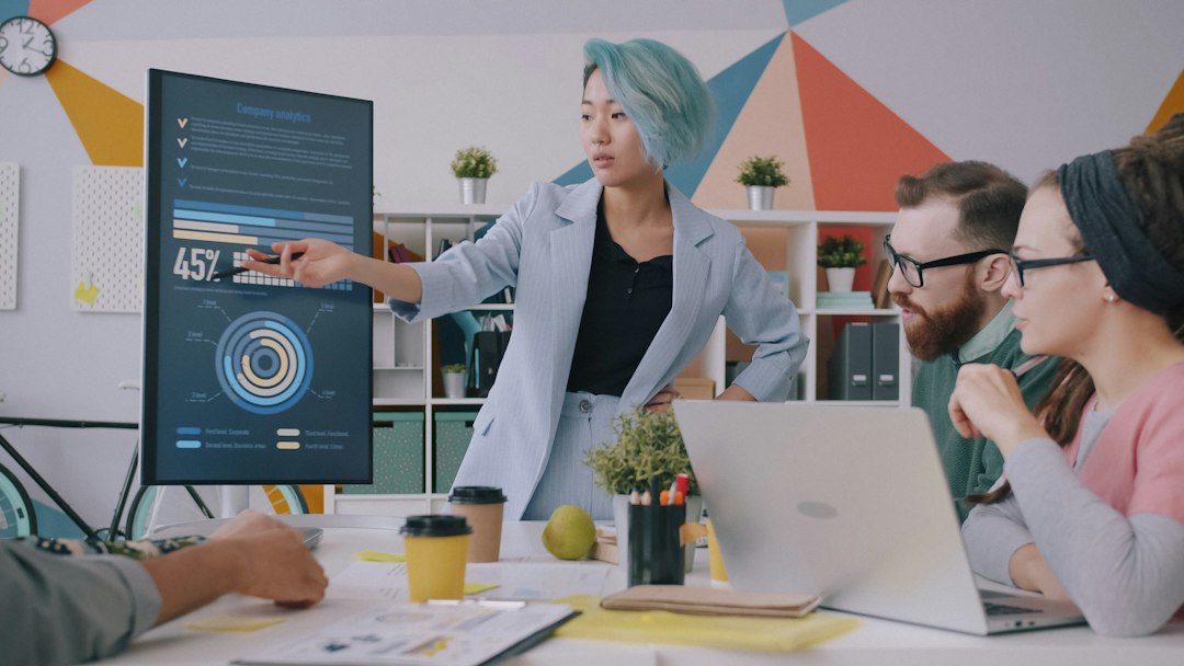 an office dashboard showing real-time growth in billable hours via colorful charts and data visualizations, sleek design, office background with warm lighting