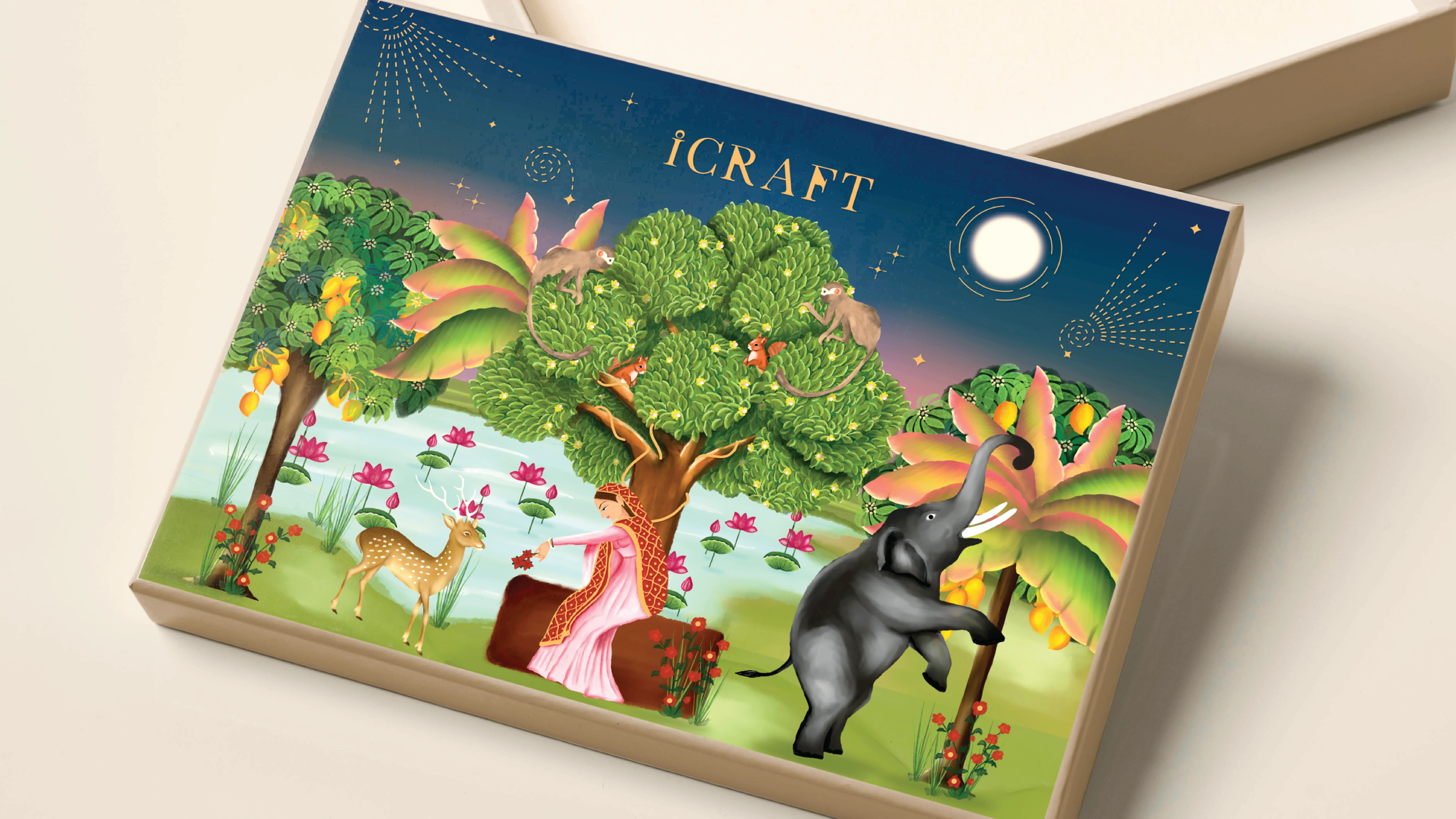 A colorful box design features an enchanting, whimsical scene with a seated person in traditional attire under a lush tree, surrounded by a deer and an elephant reaching for fruit, set against a twilight sky with a bright moon, highlighting the theme of nature and artistry.